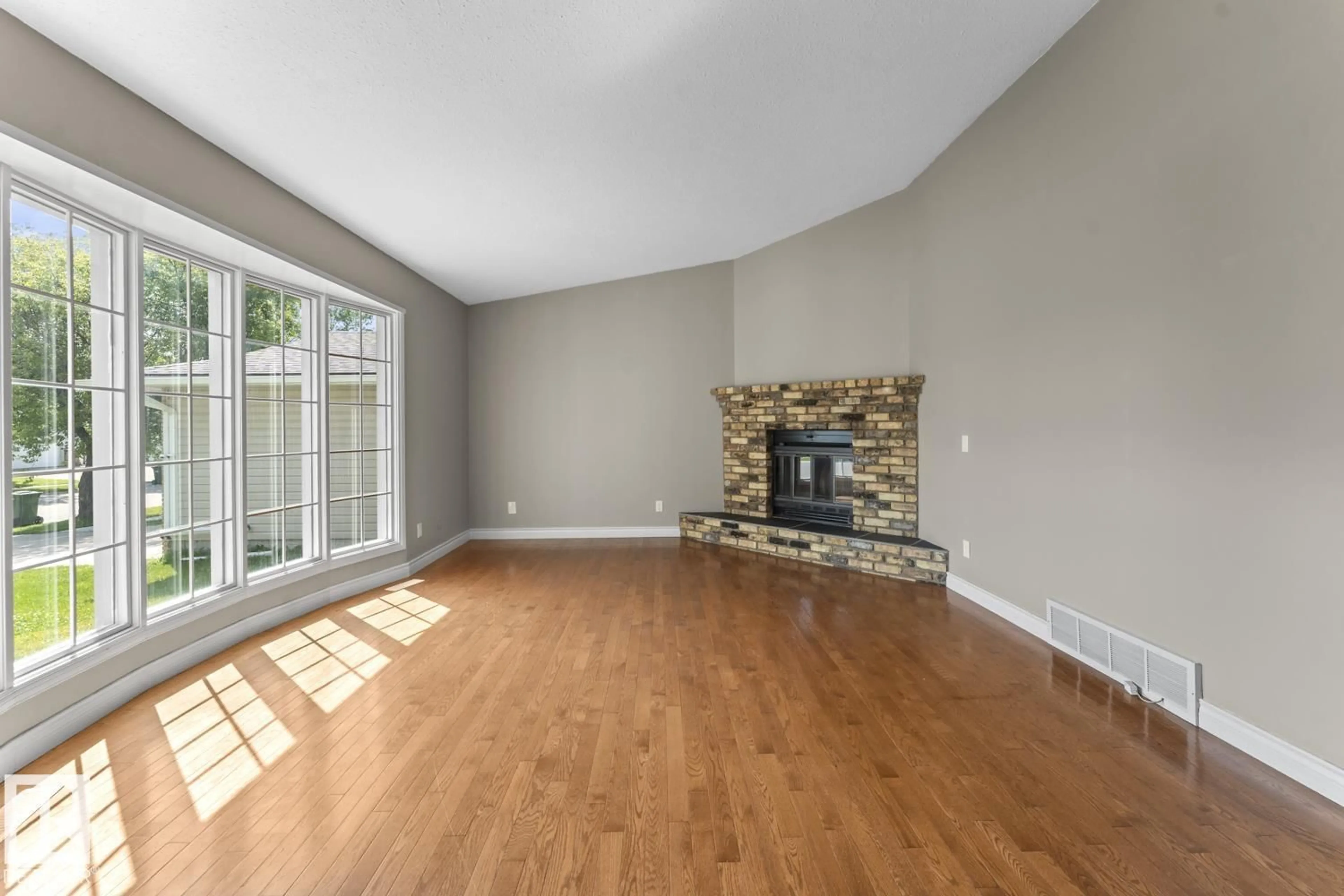 Living room with furniture, wood/laminate floor for 4308 41A ST, Bonnyville Town Alberta T9N1W3