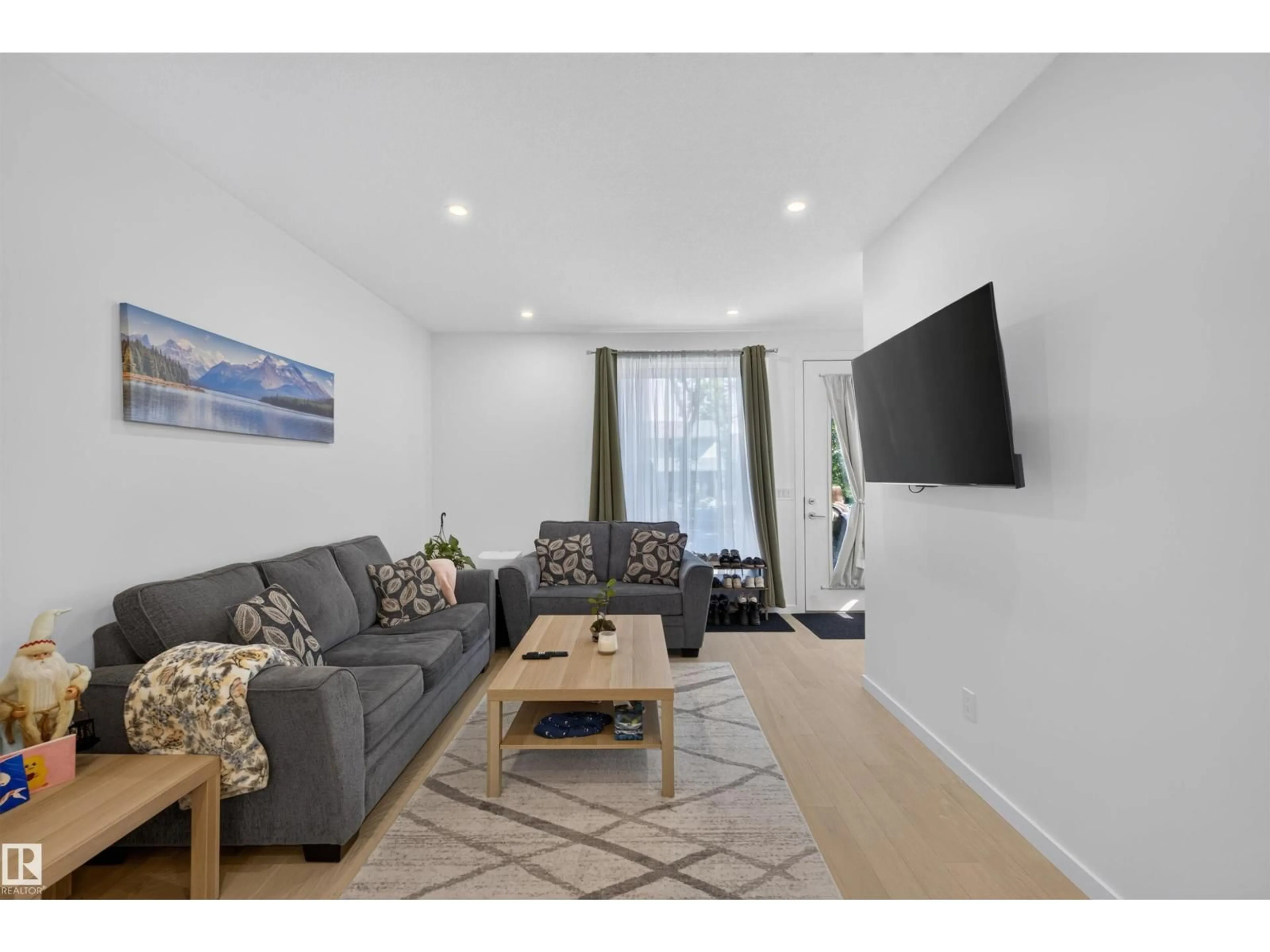 Living room with furniture, unknown for 8551 81 AV, Edmonton Alberta T6C0W3