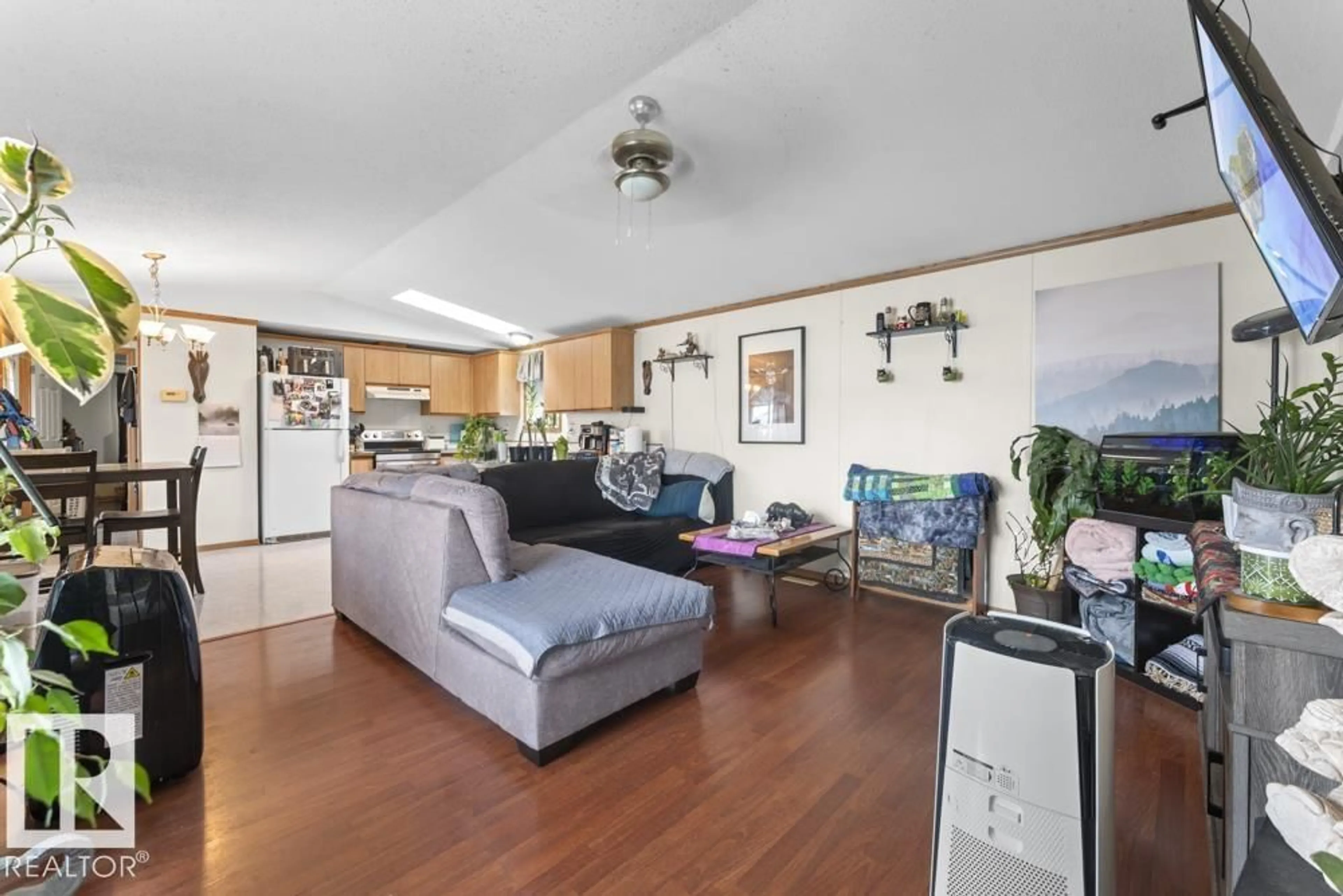 Living room with furniture, wood/laminate floor for 52 - 4405 50 AV, Cold Lake Alberta T9M1Z4