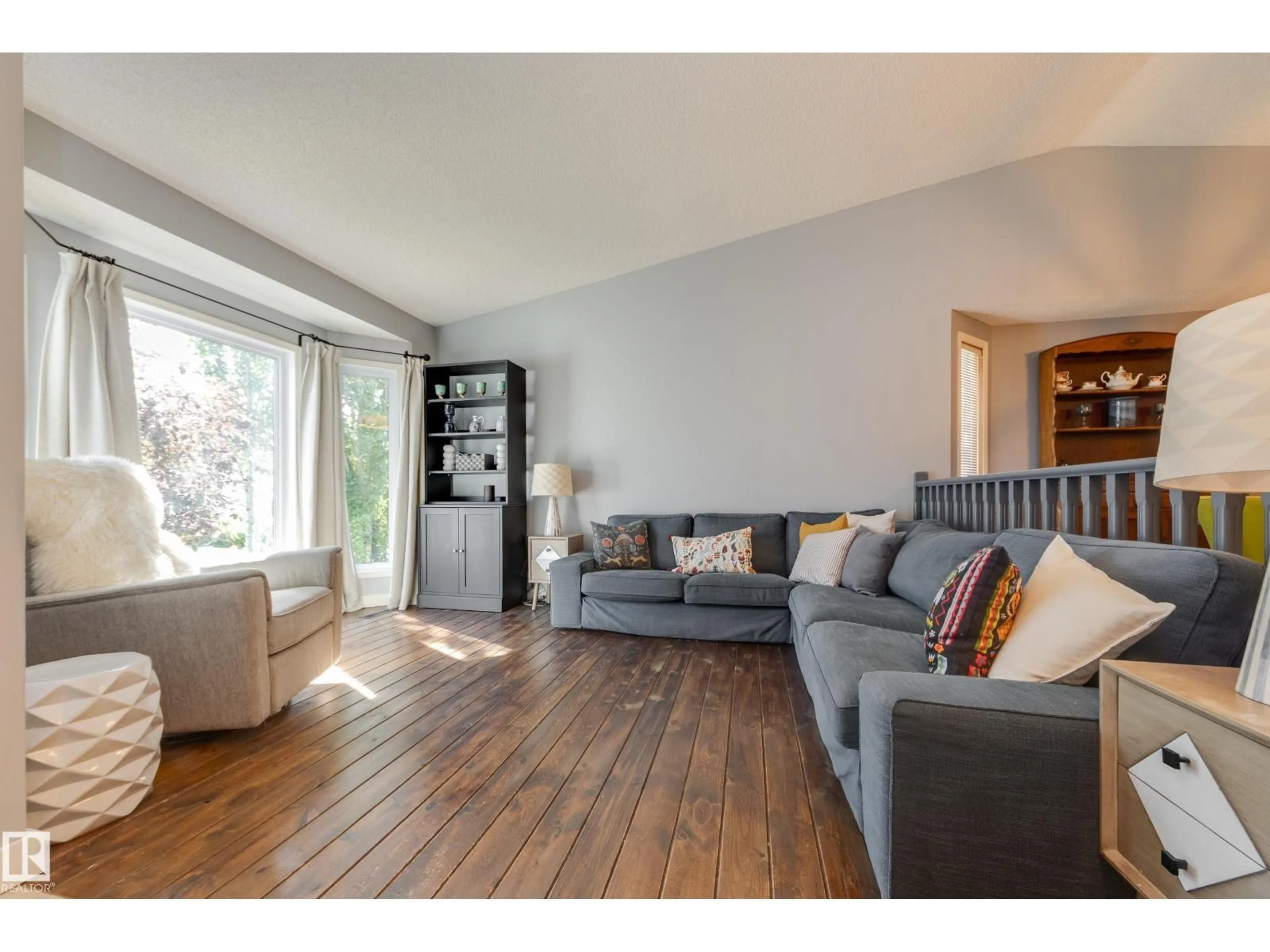 Living room with furniture, wood/laminate floor for 4810 42 ST, Beaumont Alberta T4X1H2