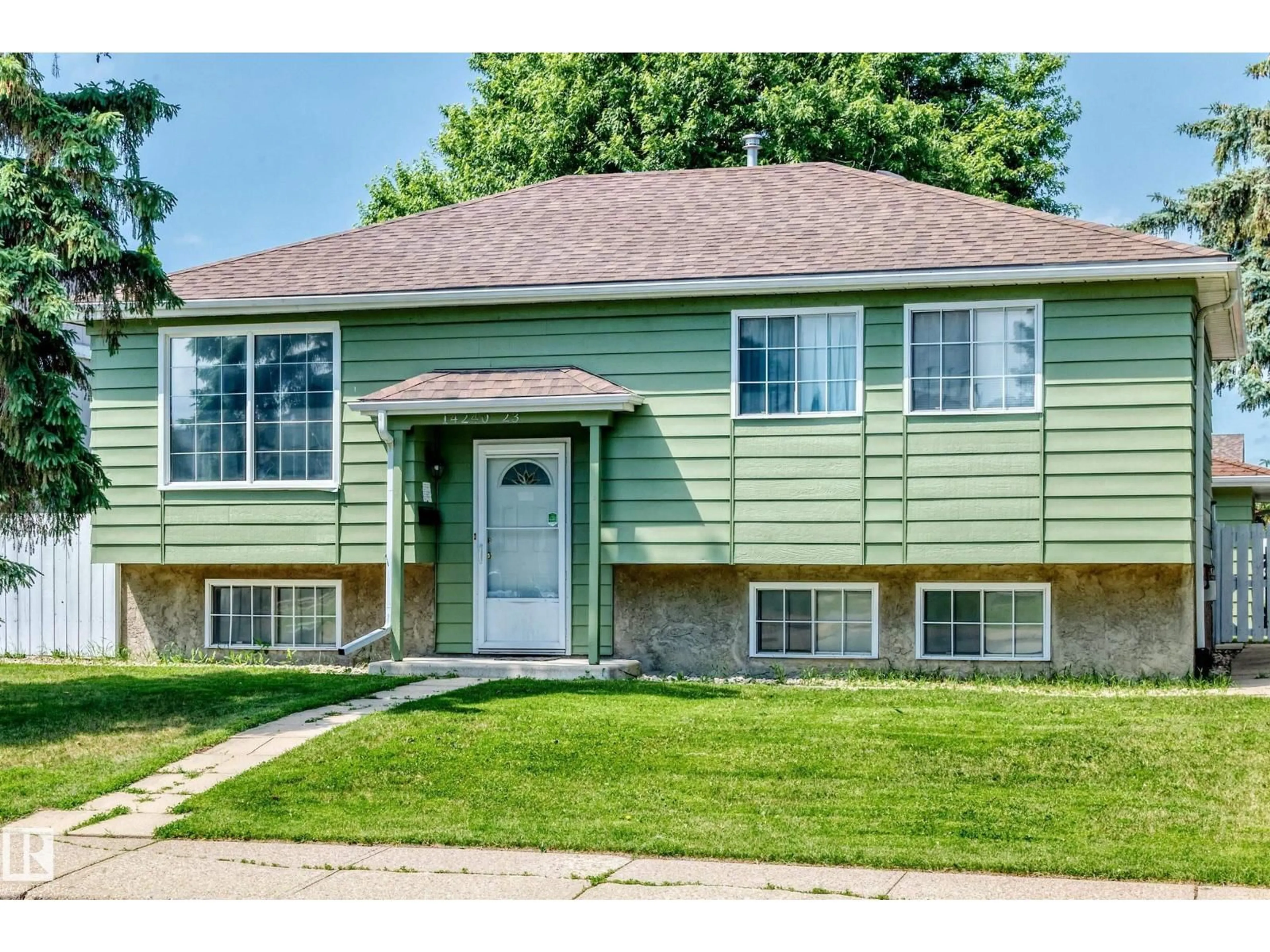 Home with vinyl exterior material, street for 14240 23 ST, Edmonton Alberta T5Y1E8