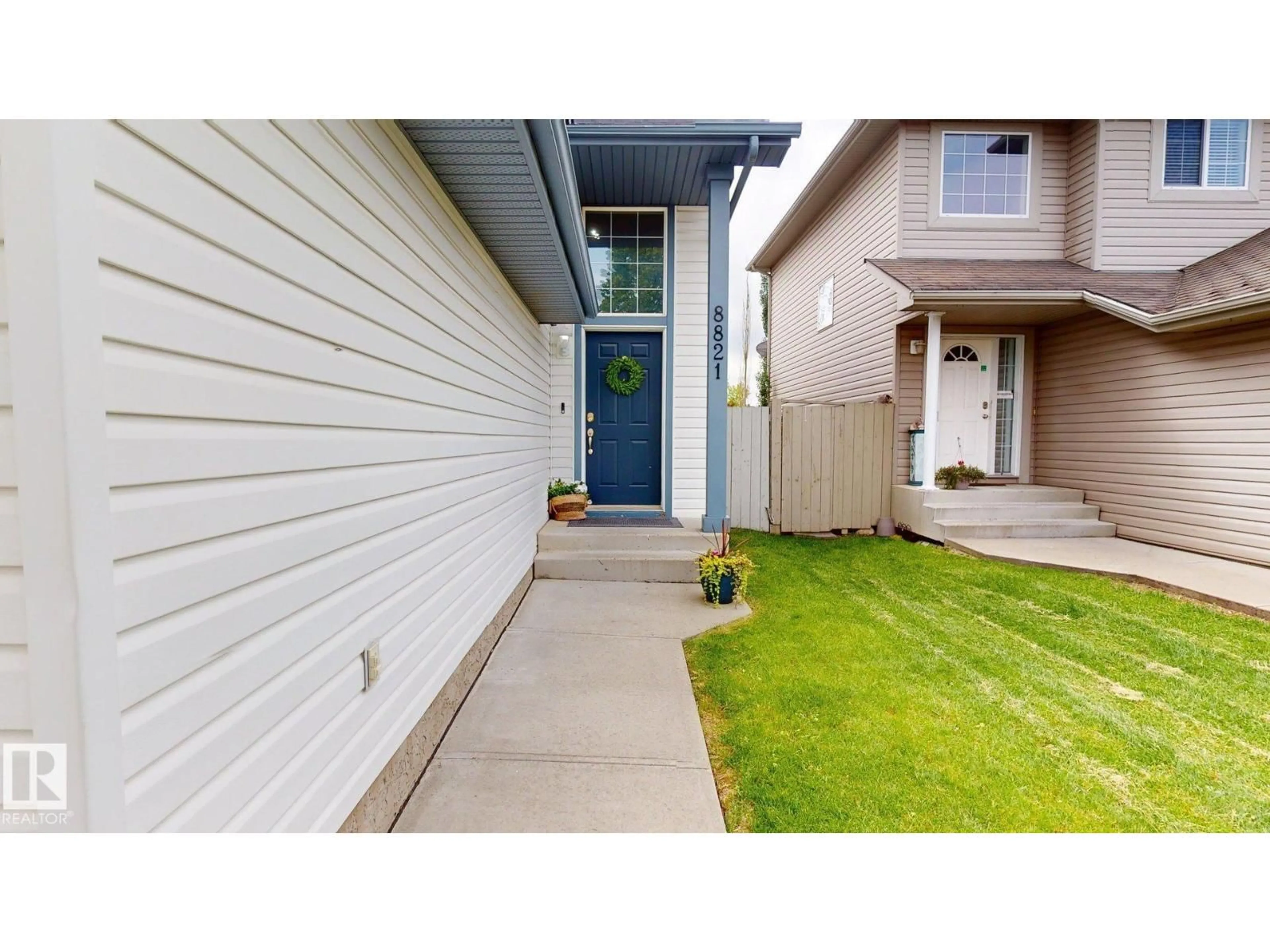 Home with vinyl exterior material, street for SW - 8821 8 AV, Edmonton Alberta T6X1C4