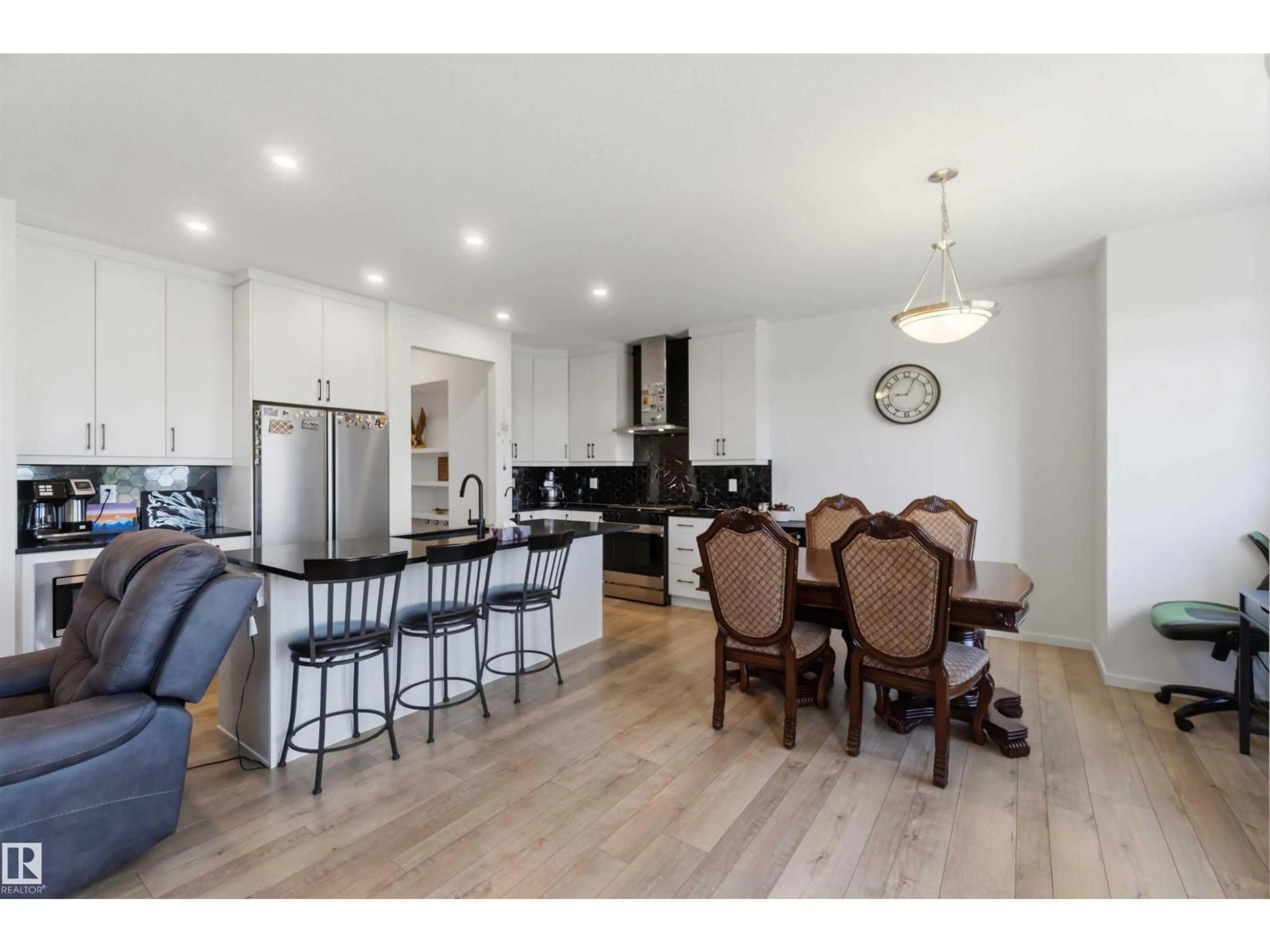 Open concept kitchen, wood/laminate floor for 1070 STONESIDE RD, Sherwood Park Alberta T8H3A1