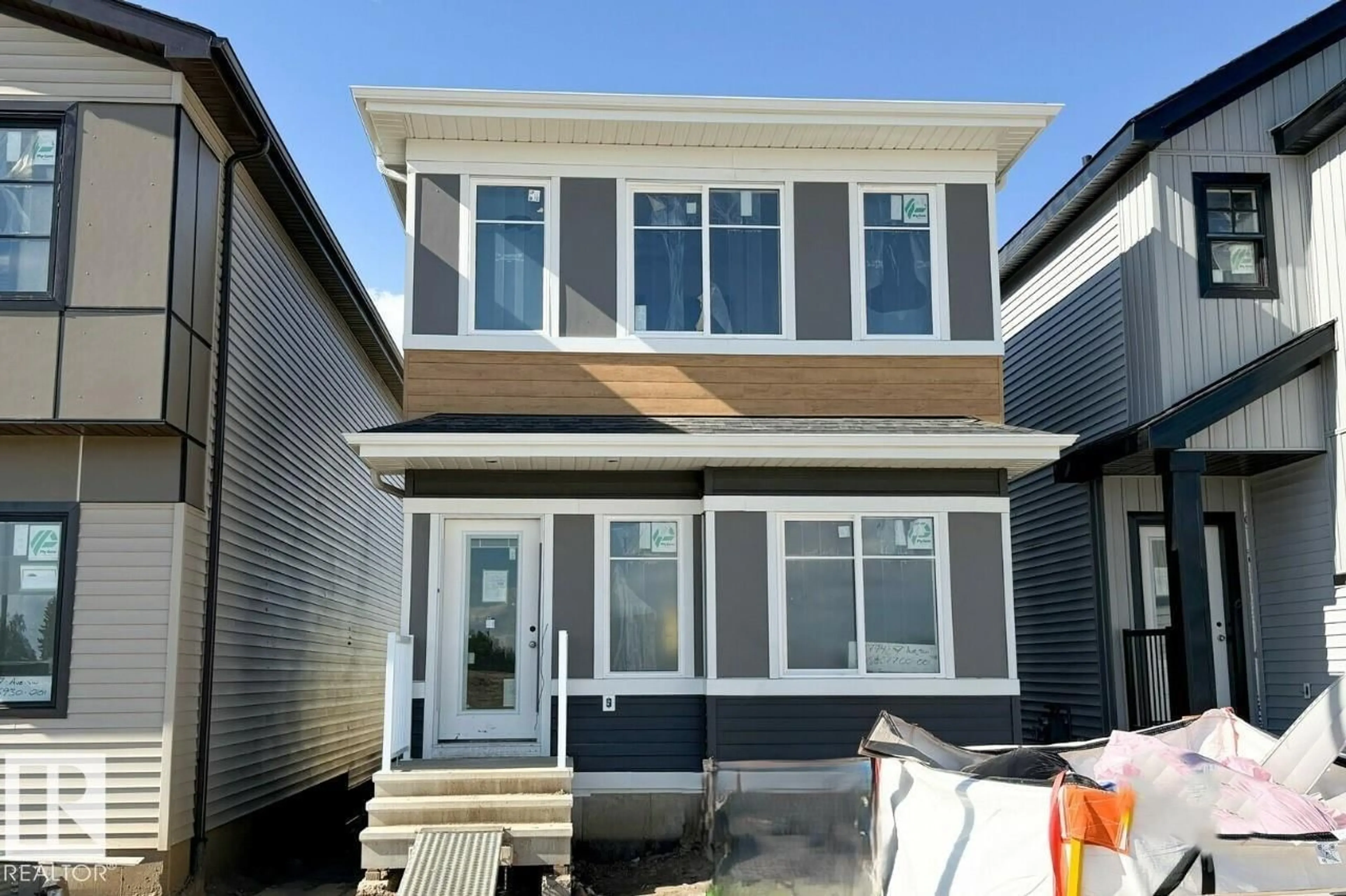 Home with vinyl exterior material, street for SW - 2744 7 AV, Edmonton Alberta T6X1N8
