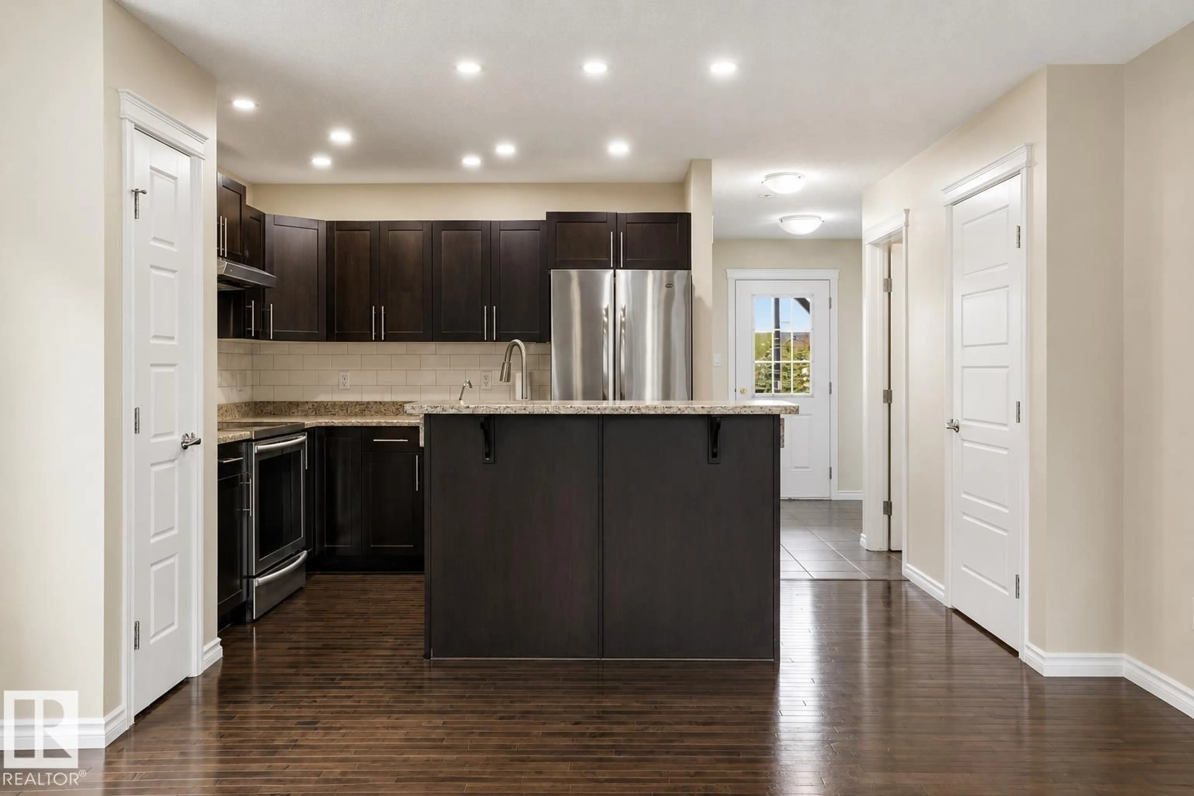 Open concept kitchen, wood/laminate floor for 445 WATT BV, Edmonton Alberta T6X1P9