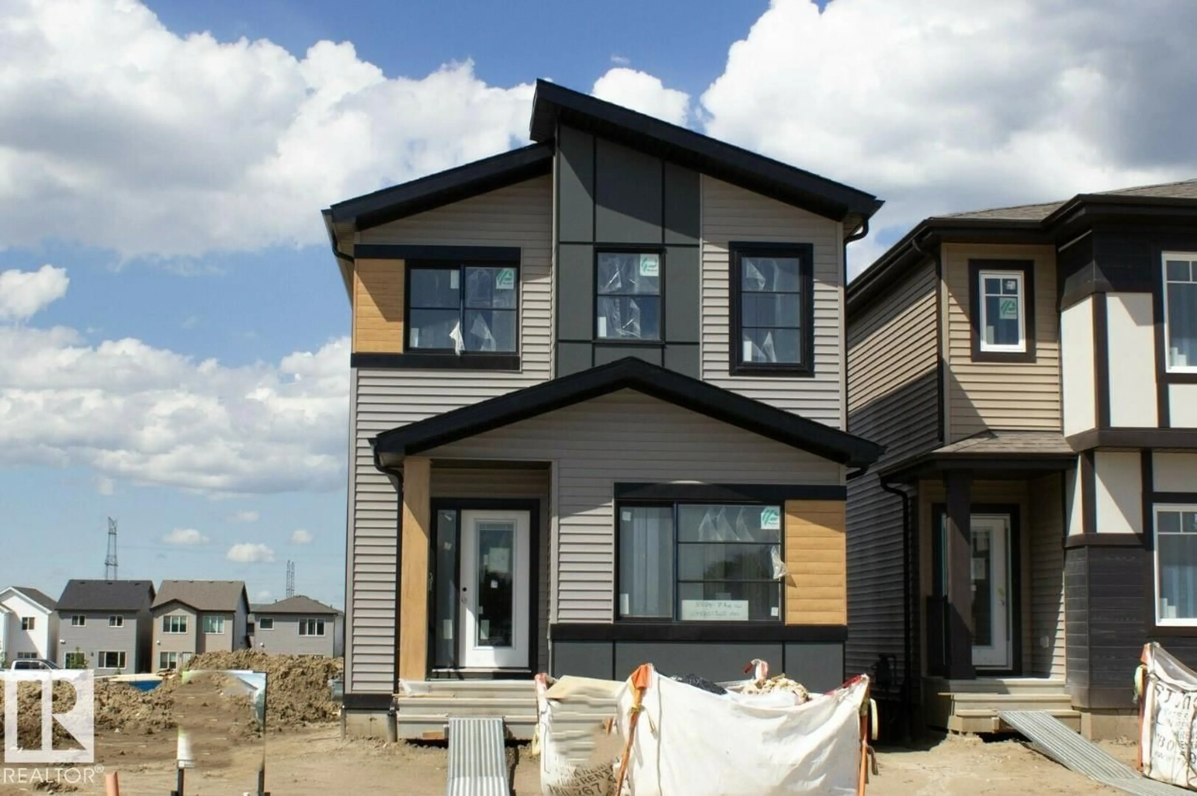 Home with vinyl exterior material, street for 2804 7 AV, Edmonton Alberta T6X2A8