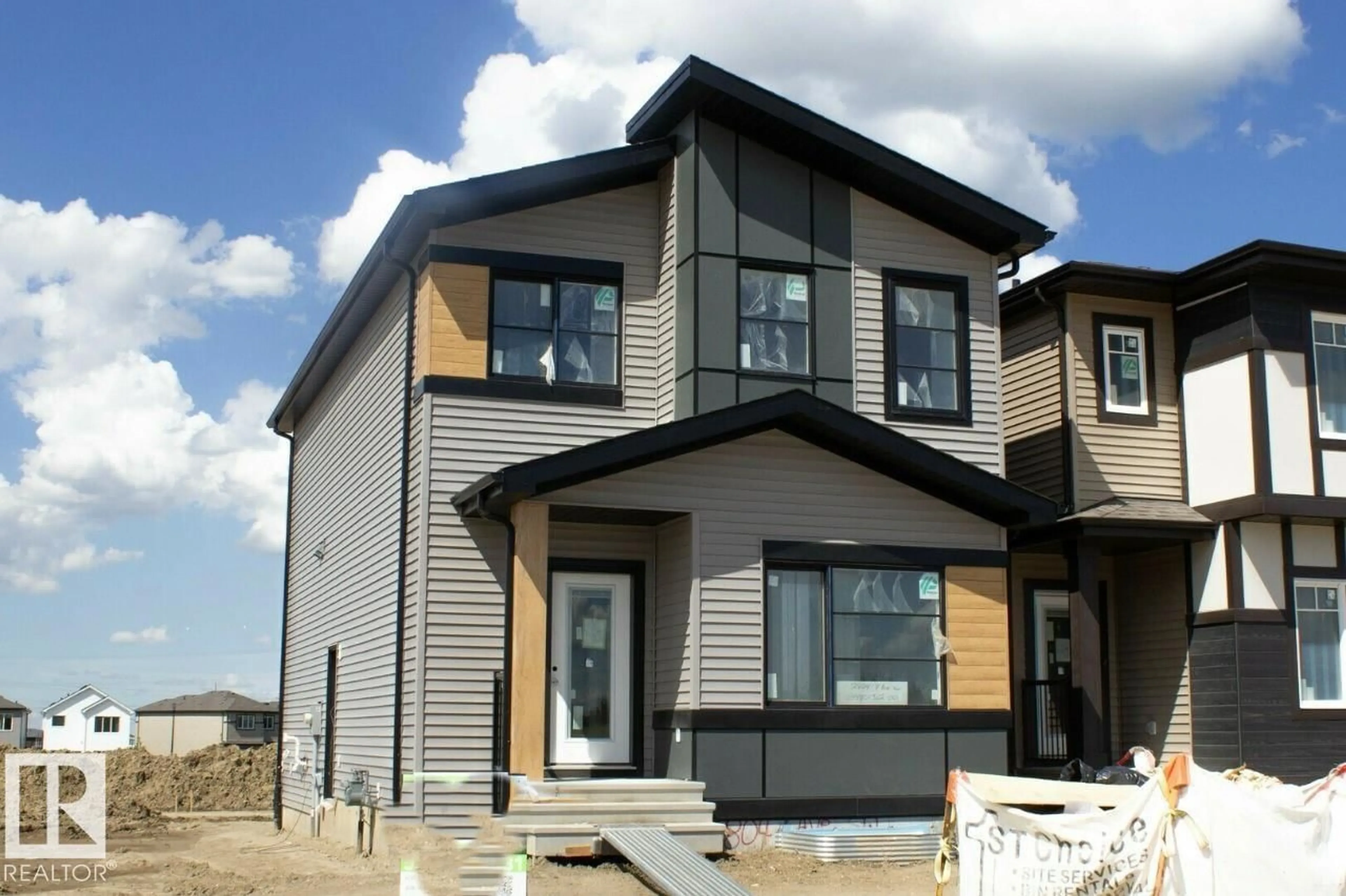 Home with vinyl exterior material, street for 2804 7 AV, Edmonton Alberta T6X2A8