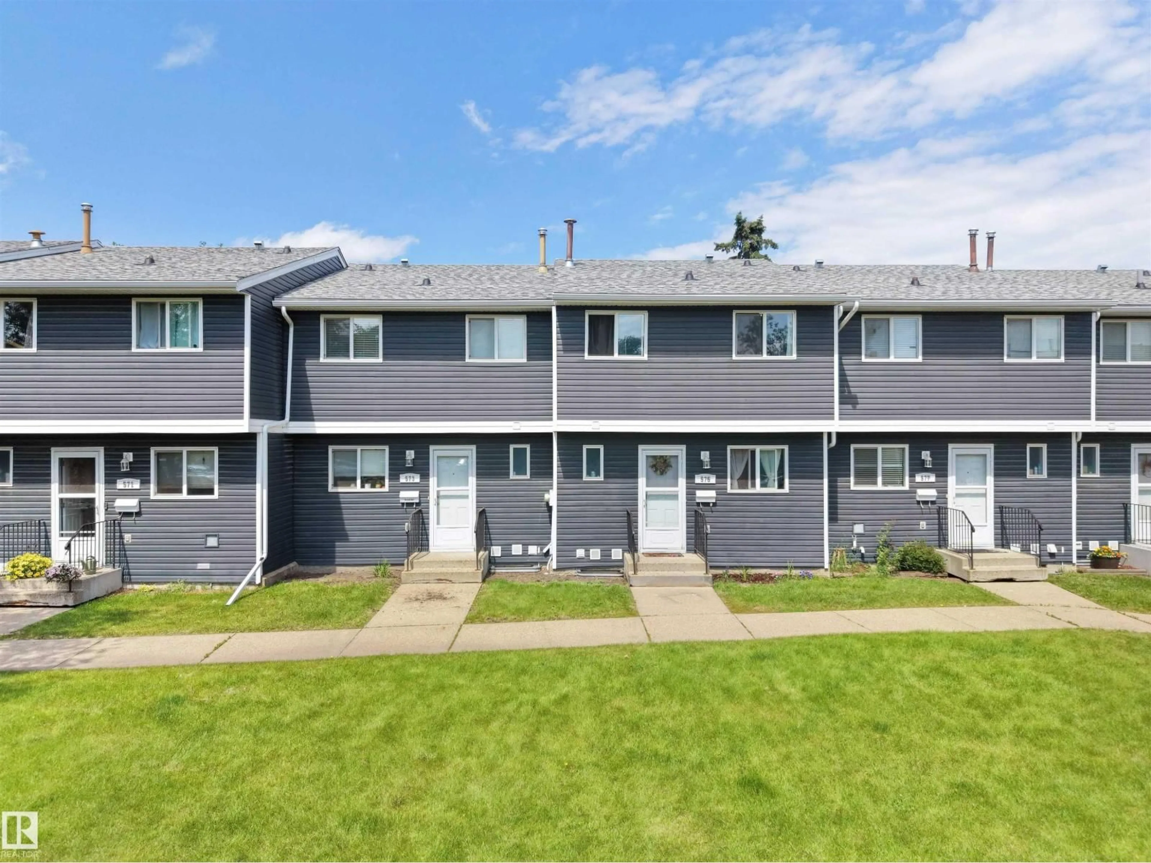 Home with vinyl exterior material, street for 575 DUNLUCE RD, Edmonton Alberta T5X4P4
