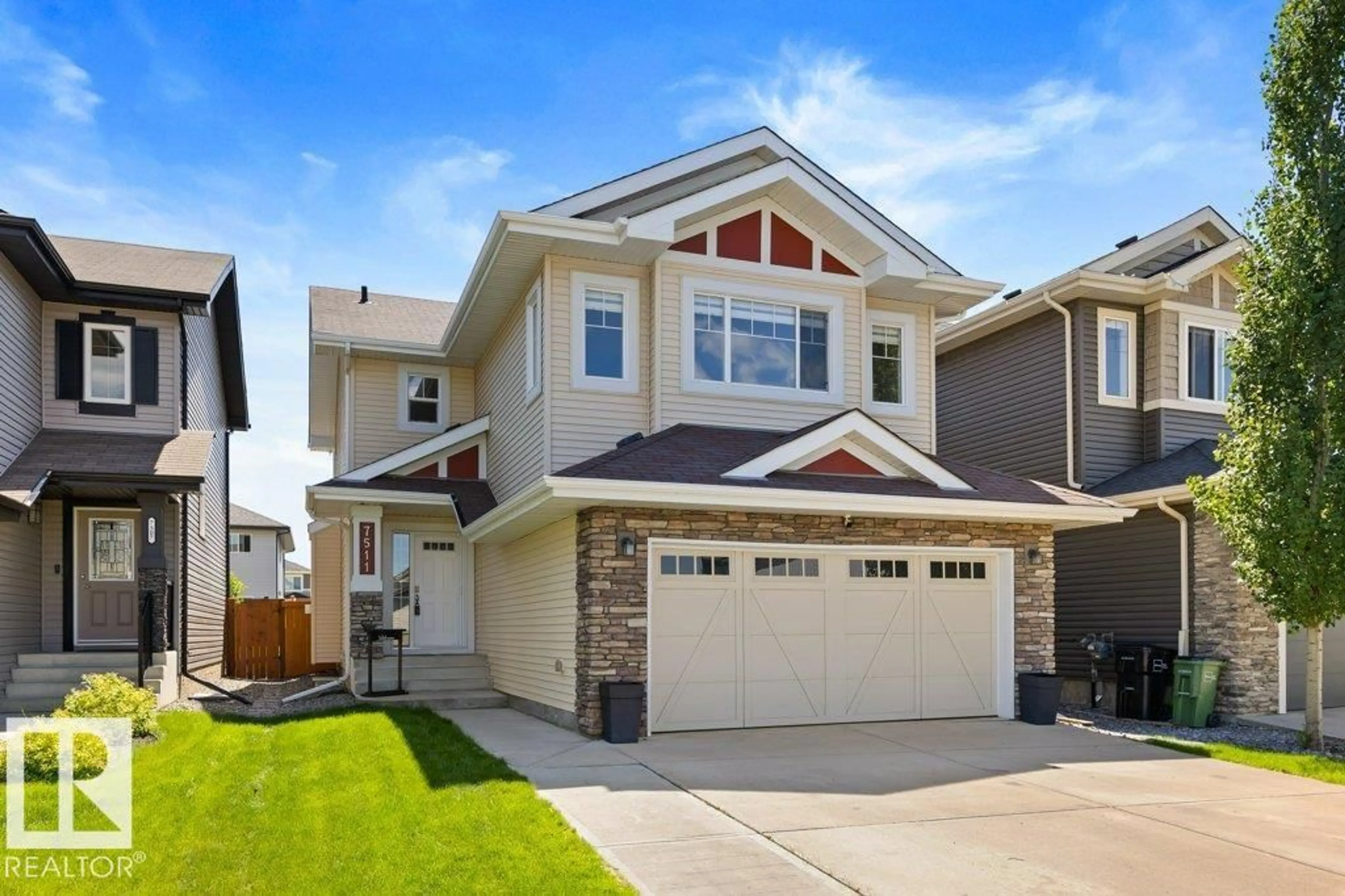 Home with vinyl exterior material, street for NW - 7511 177 AV, Edmonton Alberta T5Z0N4