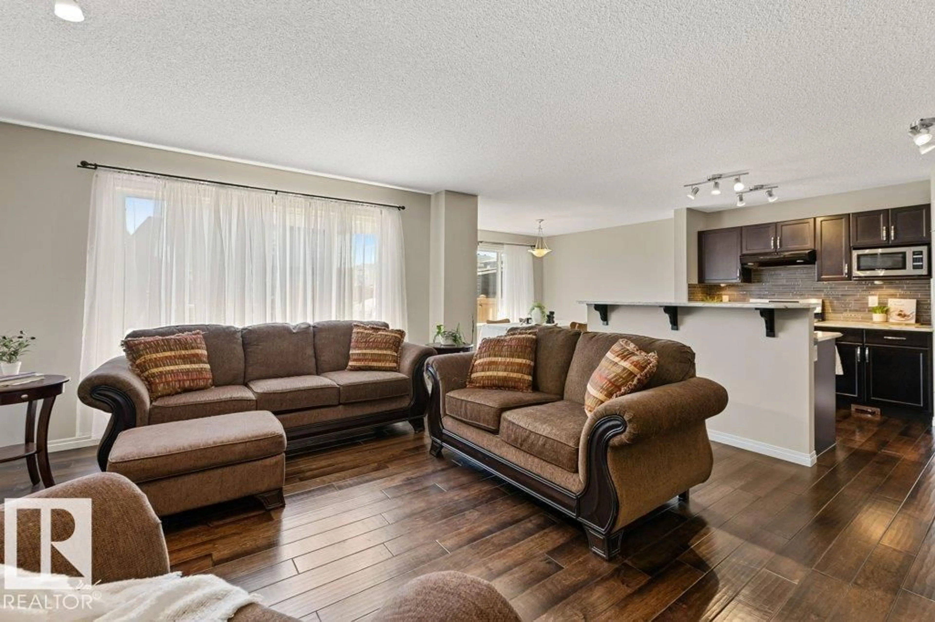 Living room with furniture, unknown for NW - 7511 177 AV, Edmonton Alberta T5Z0N4