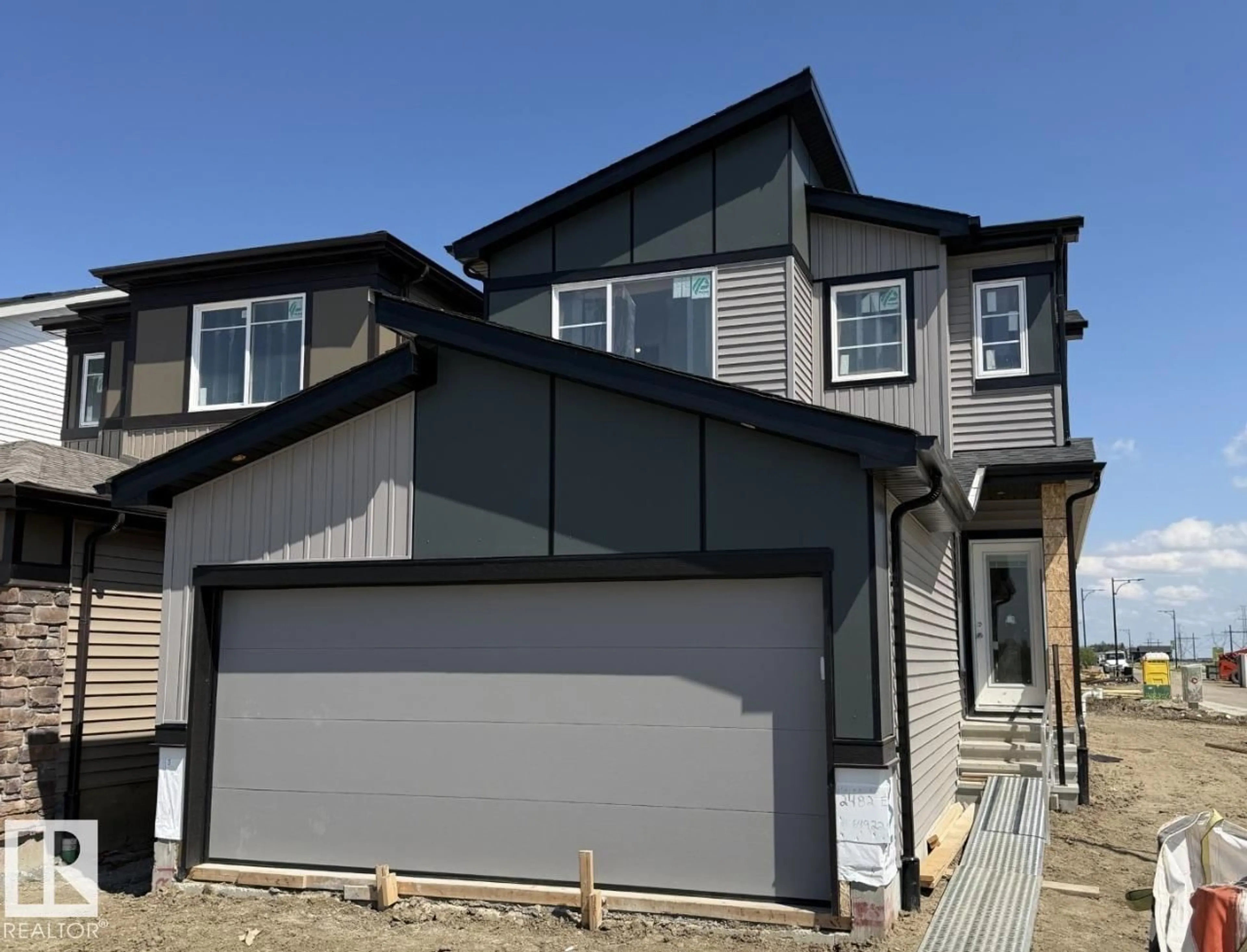 Home with vinyl exterior material, street for 2482 EGRET LO, Edmonton Alberta T6M3R4