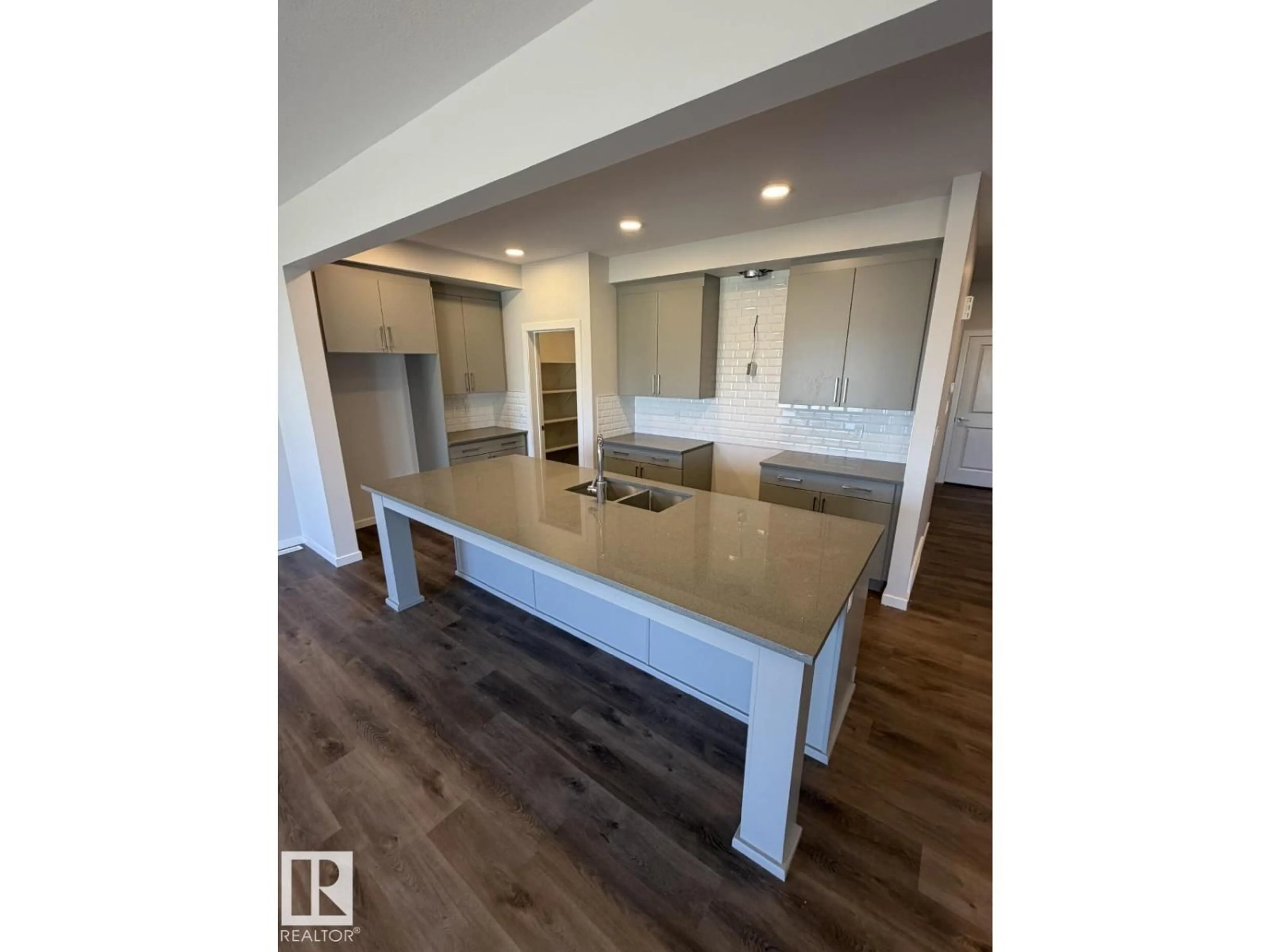 Open concept kitchen, wood/laminate floor for 2476 EGRET LO, Edmonton Alberta T6M3R4