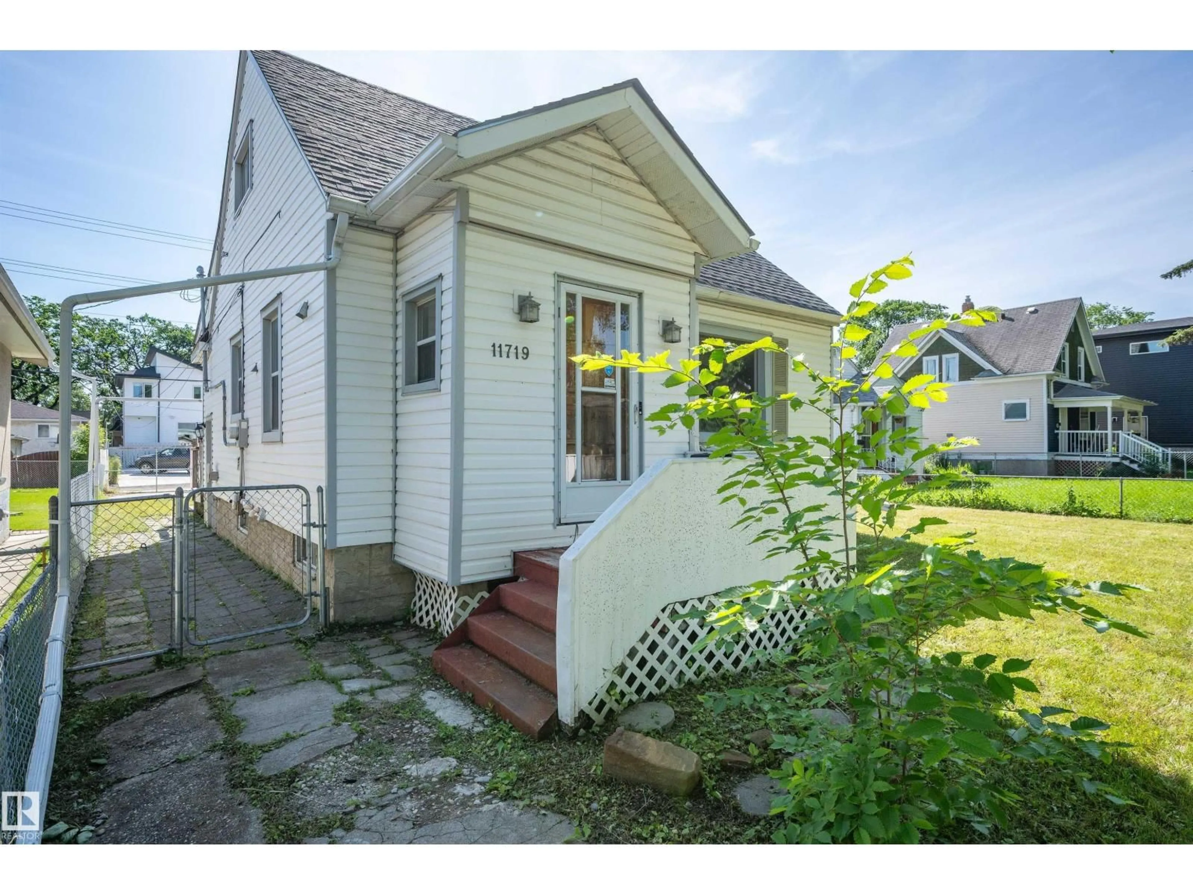 Home with vinyl exterior material, street for 11719 91 ST, Edmonton Alberta T4B5B2