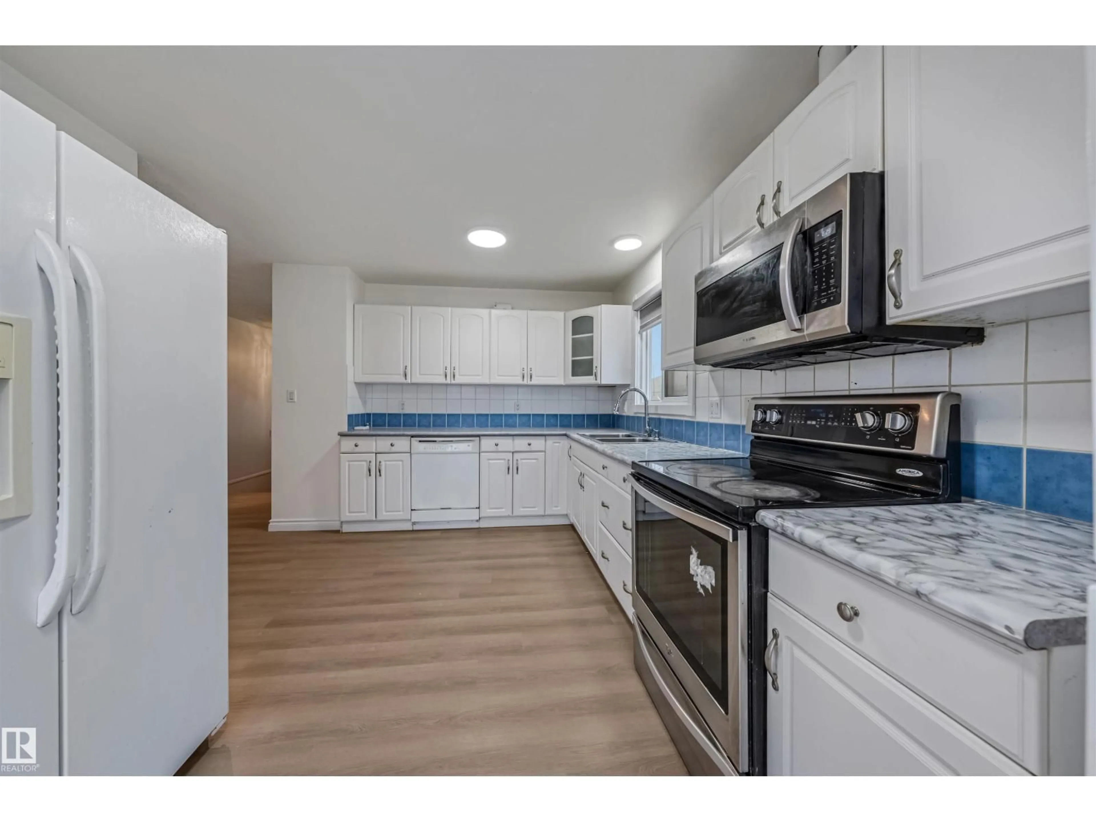 Standard kitchen, ceramic/tile floor for 2831 36 ST, Edmonton Alberta T6L3Y6