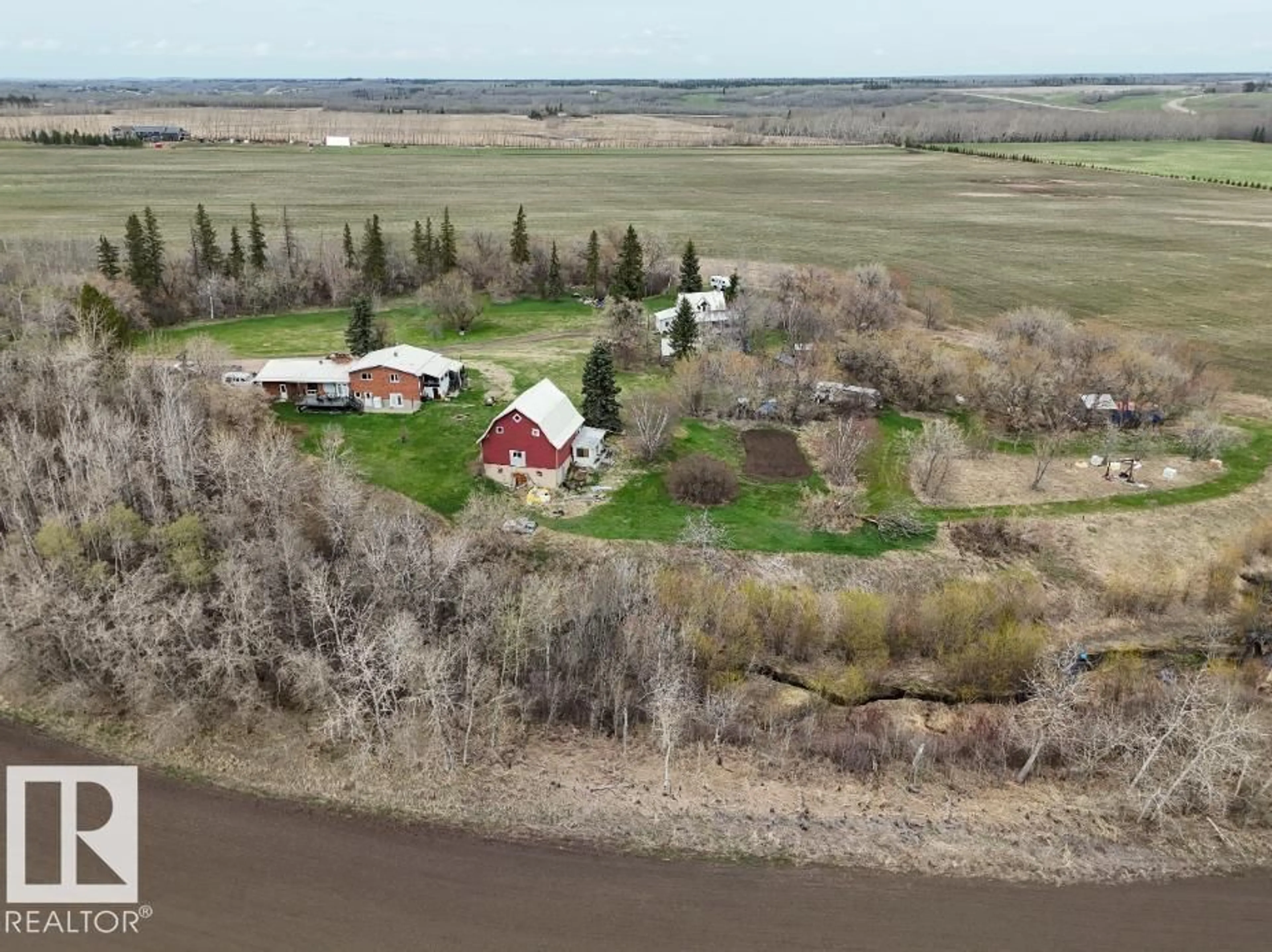 A pic from outside/outdoor area/front of a property/back of a property/a pic from drone, water/lake/river/ocean view for 56505 RANGE ROAD 233, Rural Sturgeon County Alberta T0A1N0