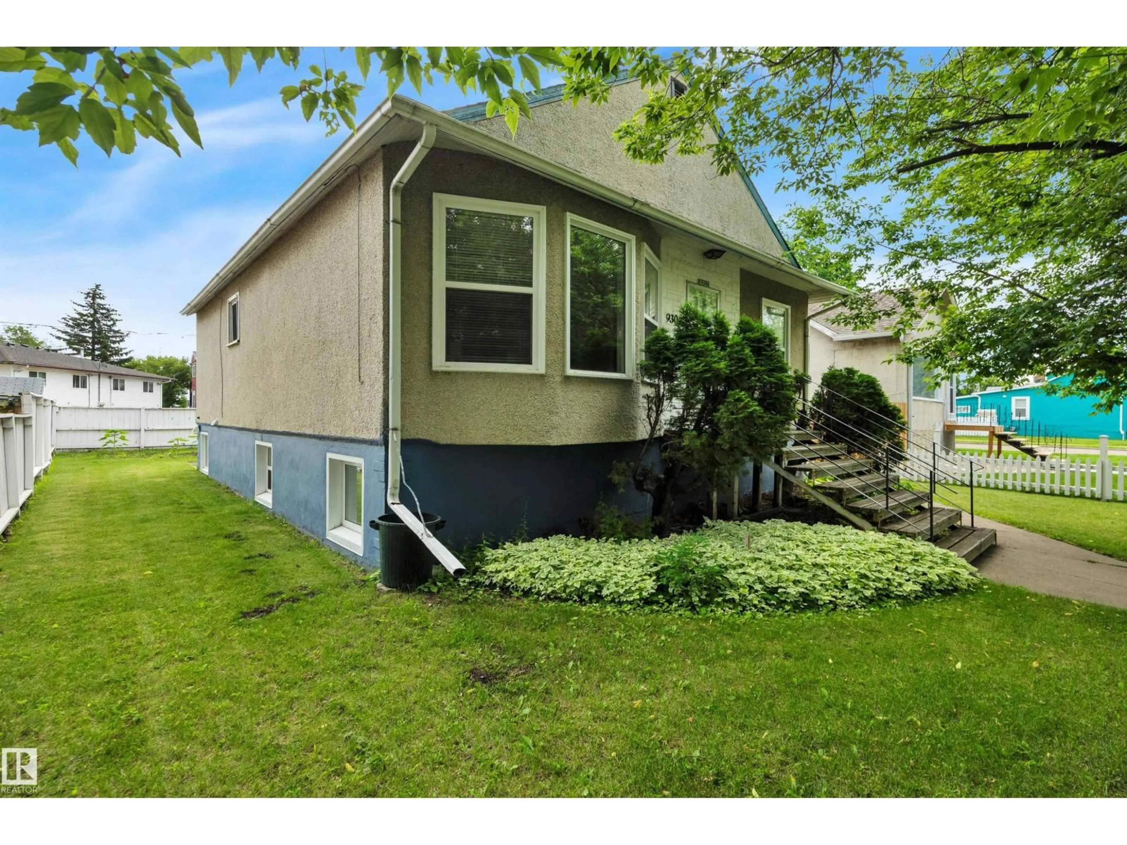 Home with vinyl exterior material, street for 9307 92 ST, Edmonton Alberta T6C3R7