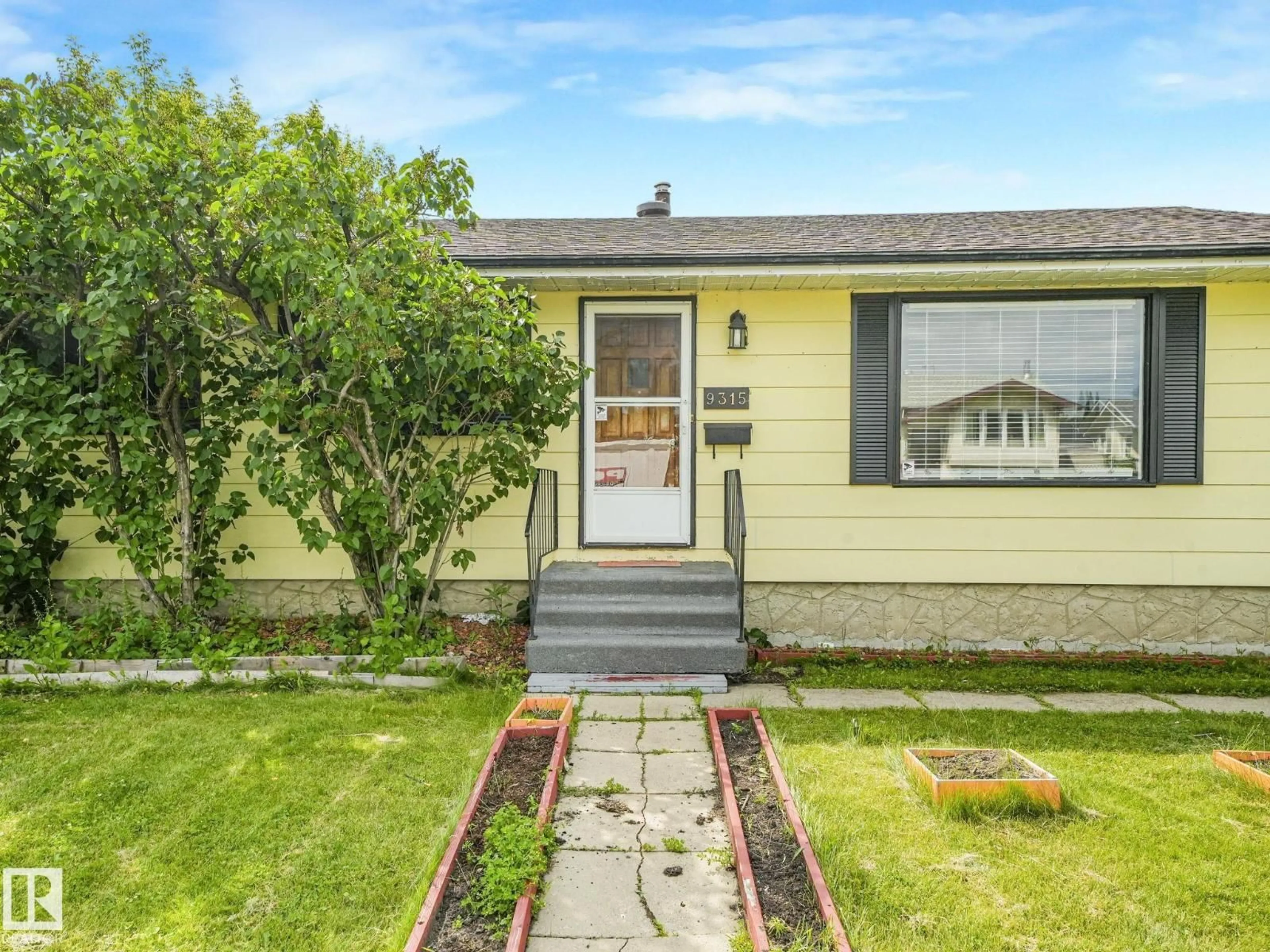 Home with vinyl exterior material, street for 9315 151 AV, Edmonton Alberta T5E2R1