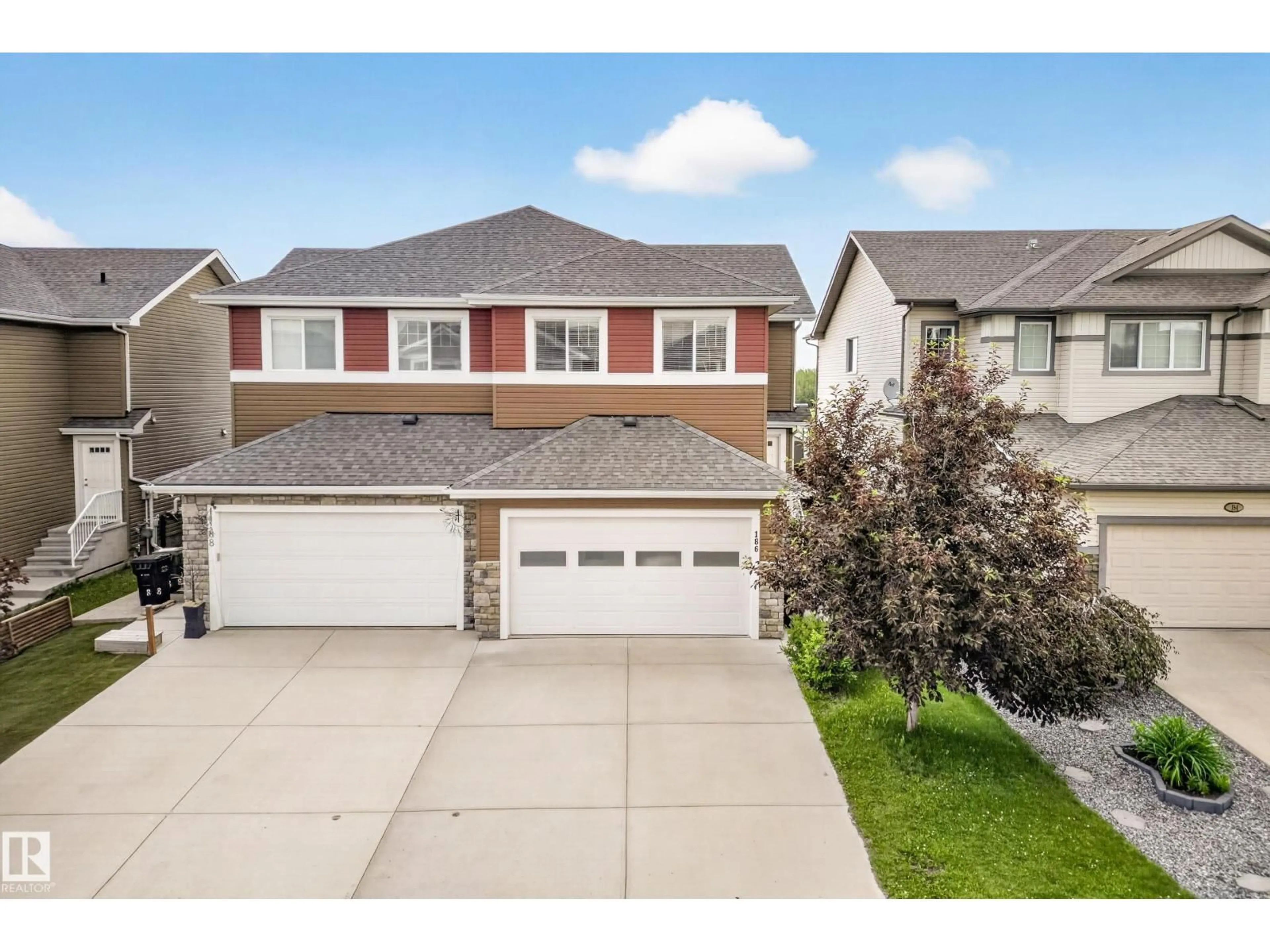 Home with vinyl exterior material, street for 186 REED PL, Leduc Alberta T9E0S6