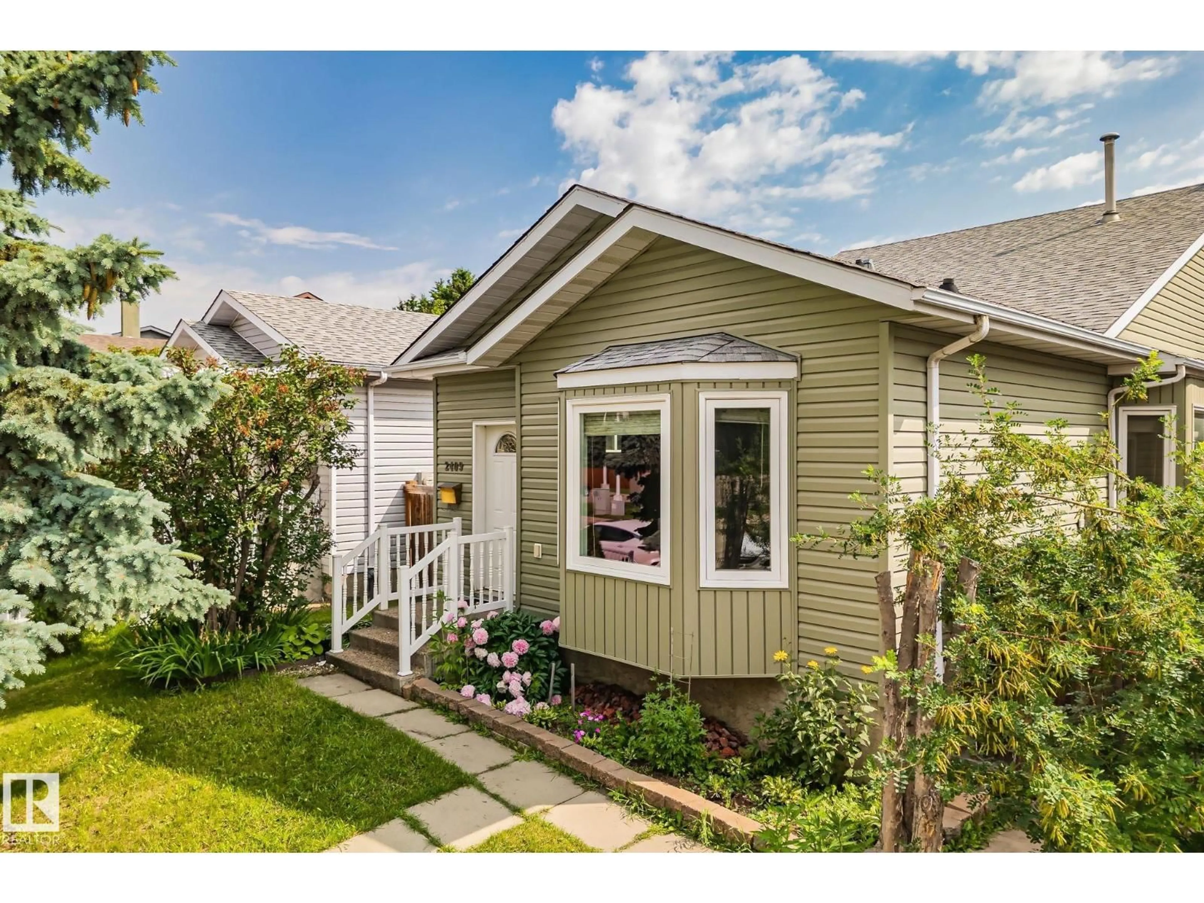 Home with vinyl exterior material, street for NW - 2409 47 ST, Edmonton Alberta T6L4P6