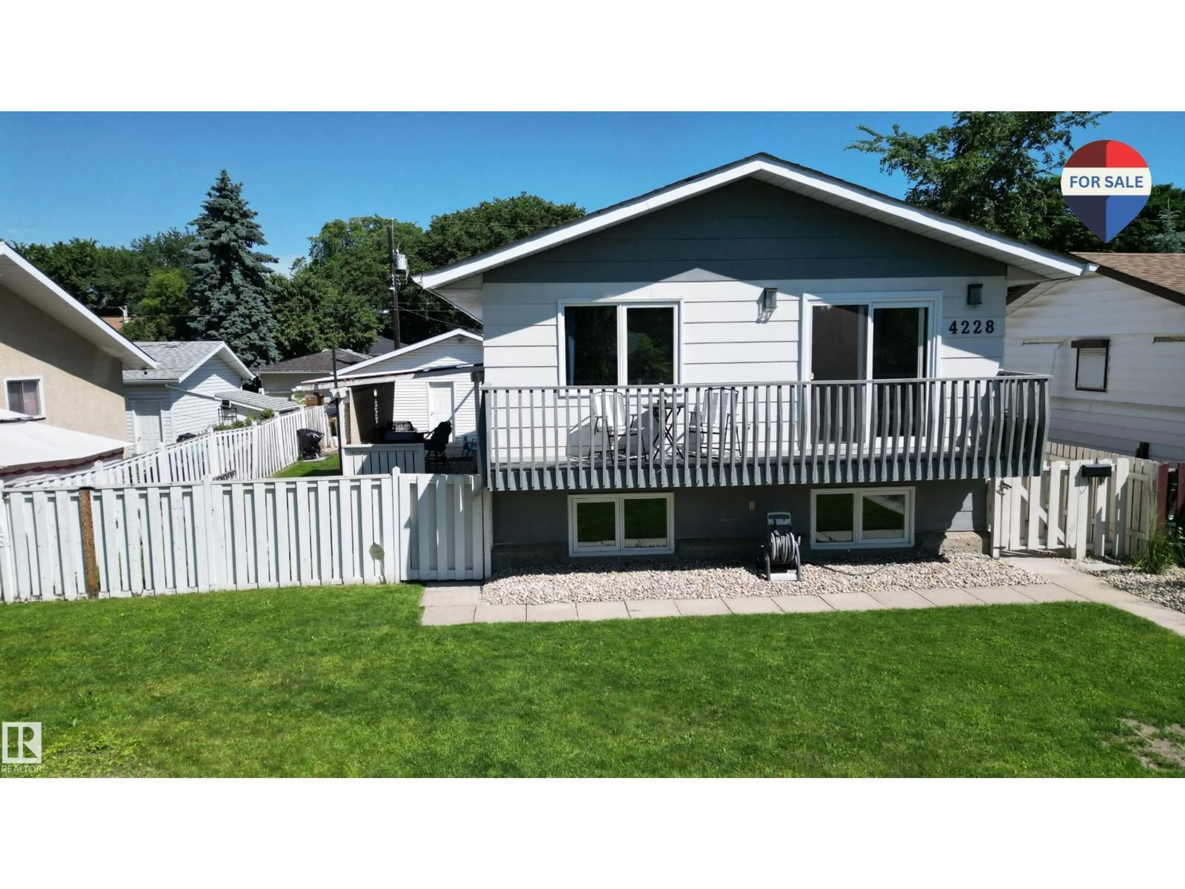 Home with vinyl exterior material, street for 4228 114 AV, Edmonton Alberta T5W0T2