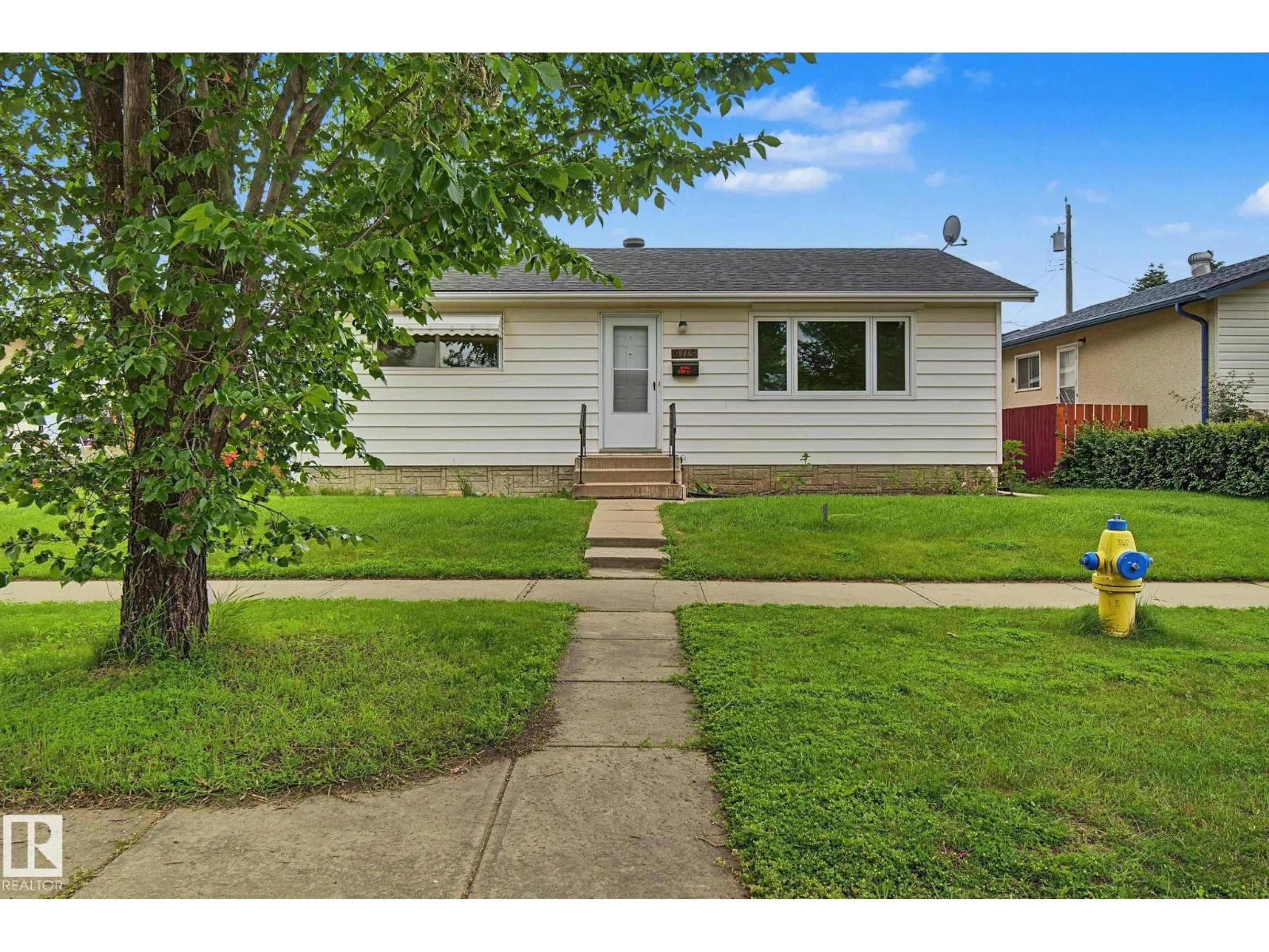 Home with vinyl exterior material, street for NW - 8115 169 ST, Edmonton Alberta T5R2W4