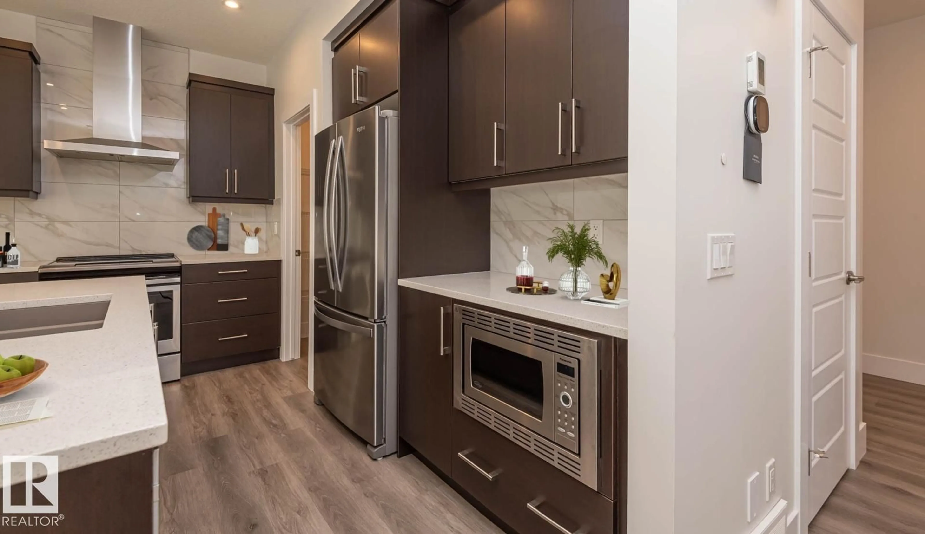 Contemporary kitchen, wood/laminate floor for 2635 DONAGHEY CR, Edmonton Alberta T6W4T1
