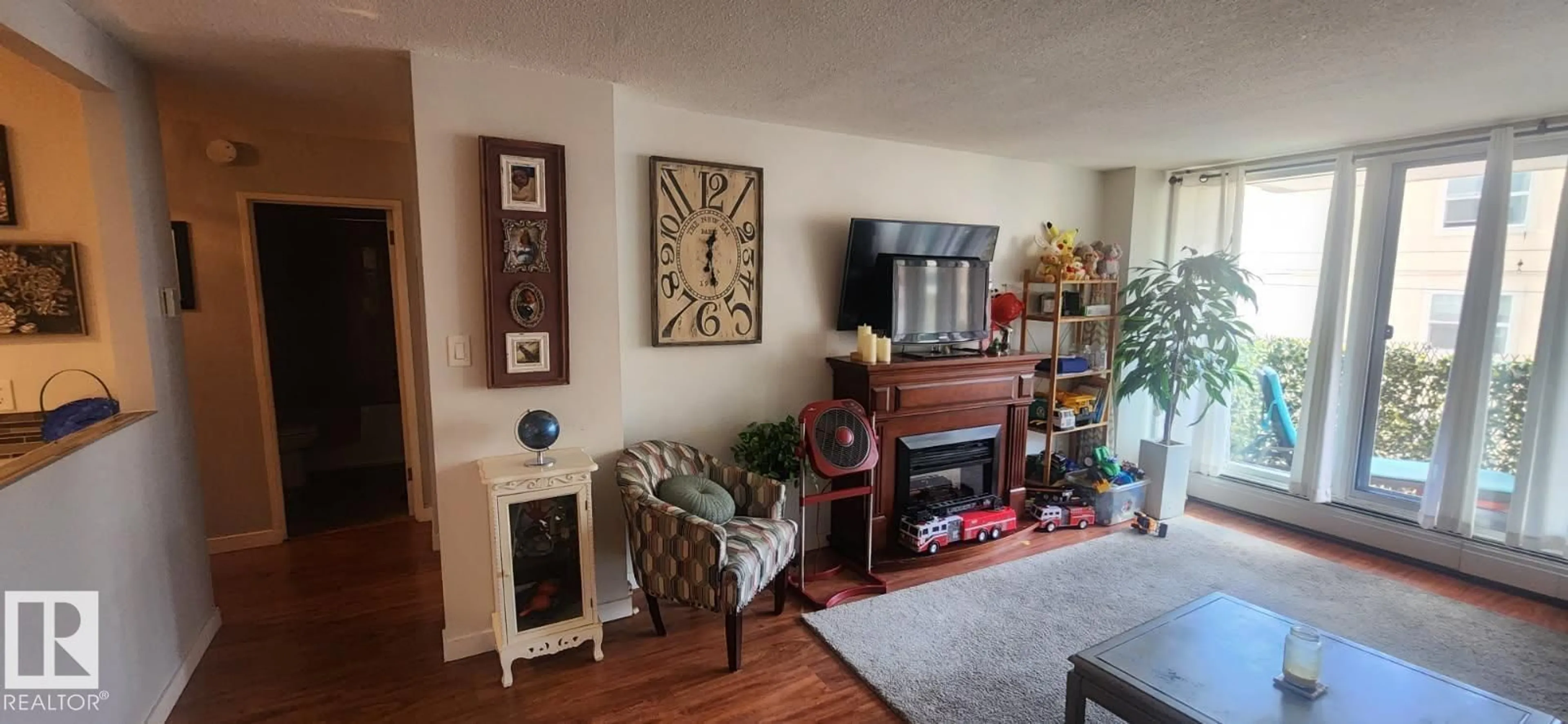 Living room with furniture, wood/laminate floor for #407 - 9835 113 ST, Edmonton Alberta T5K1N4