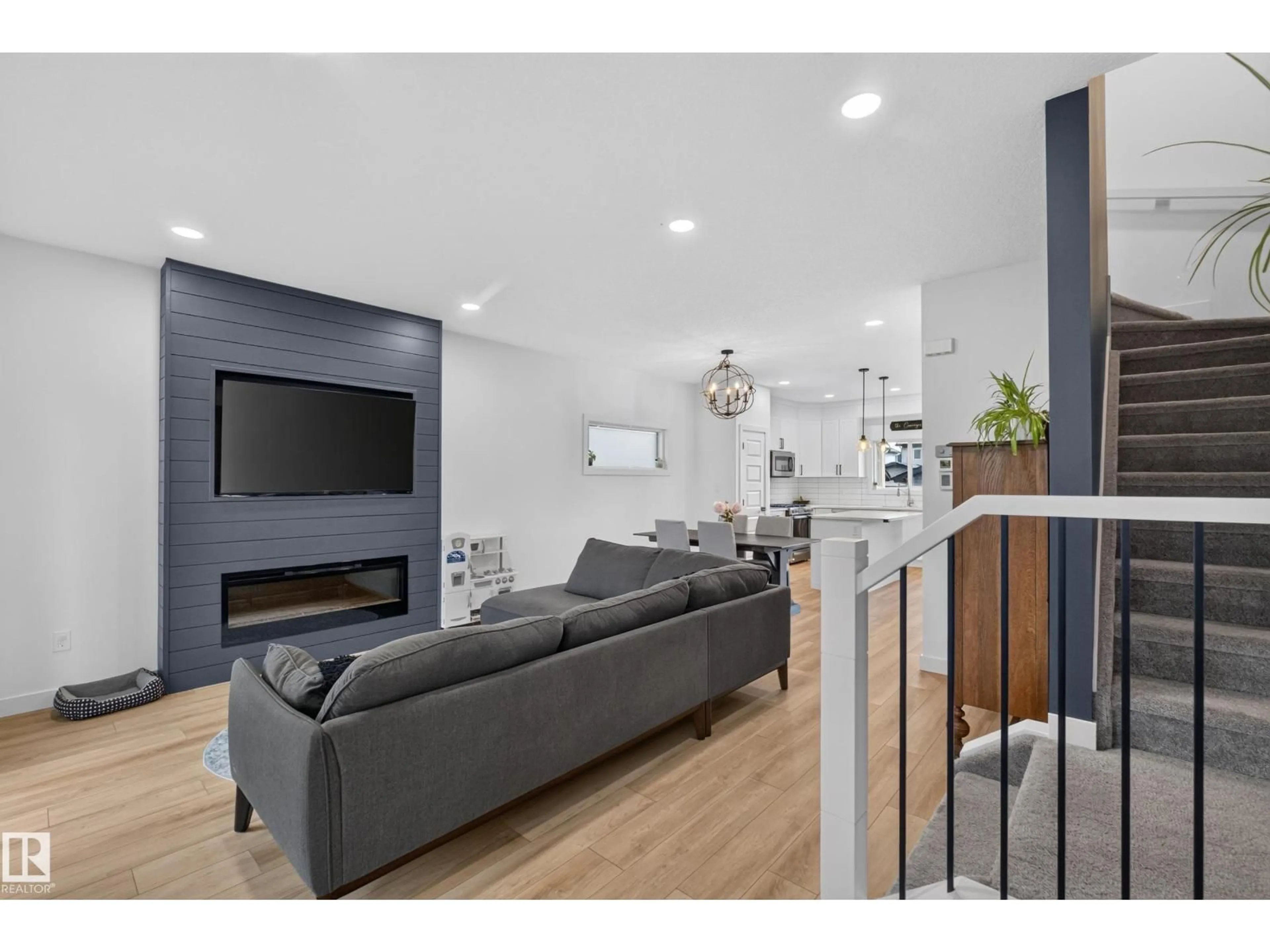Living room with furniture, wood/laminate floor for 548 KLEINS CR, Leduc Alberta T9E1M5