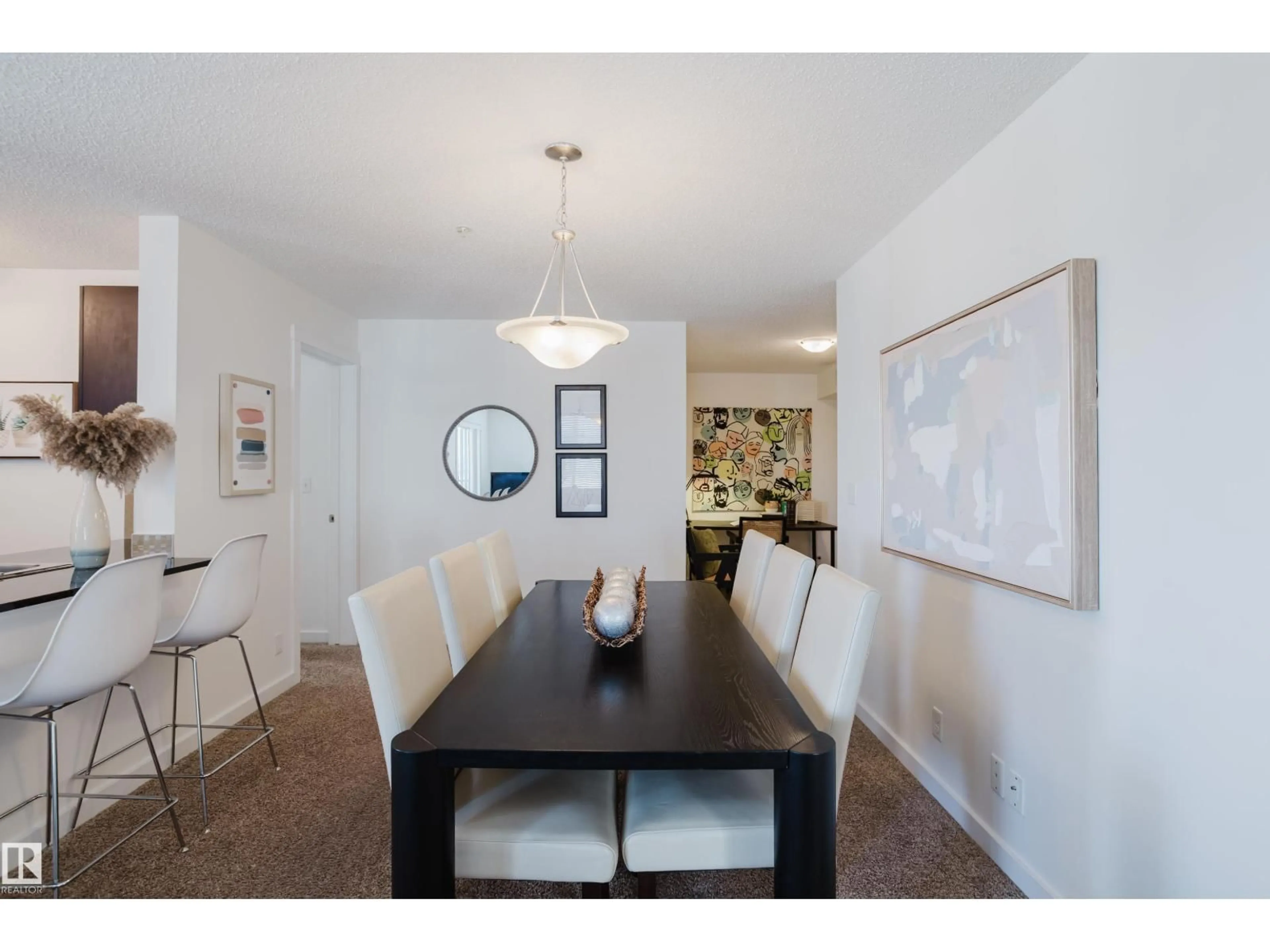 Dining room, wood/laminate floor for 319 - 5804 MULLEN PL, Edmonton Alberta T6R0W3