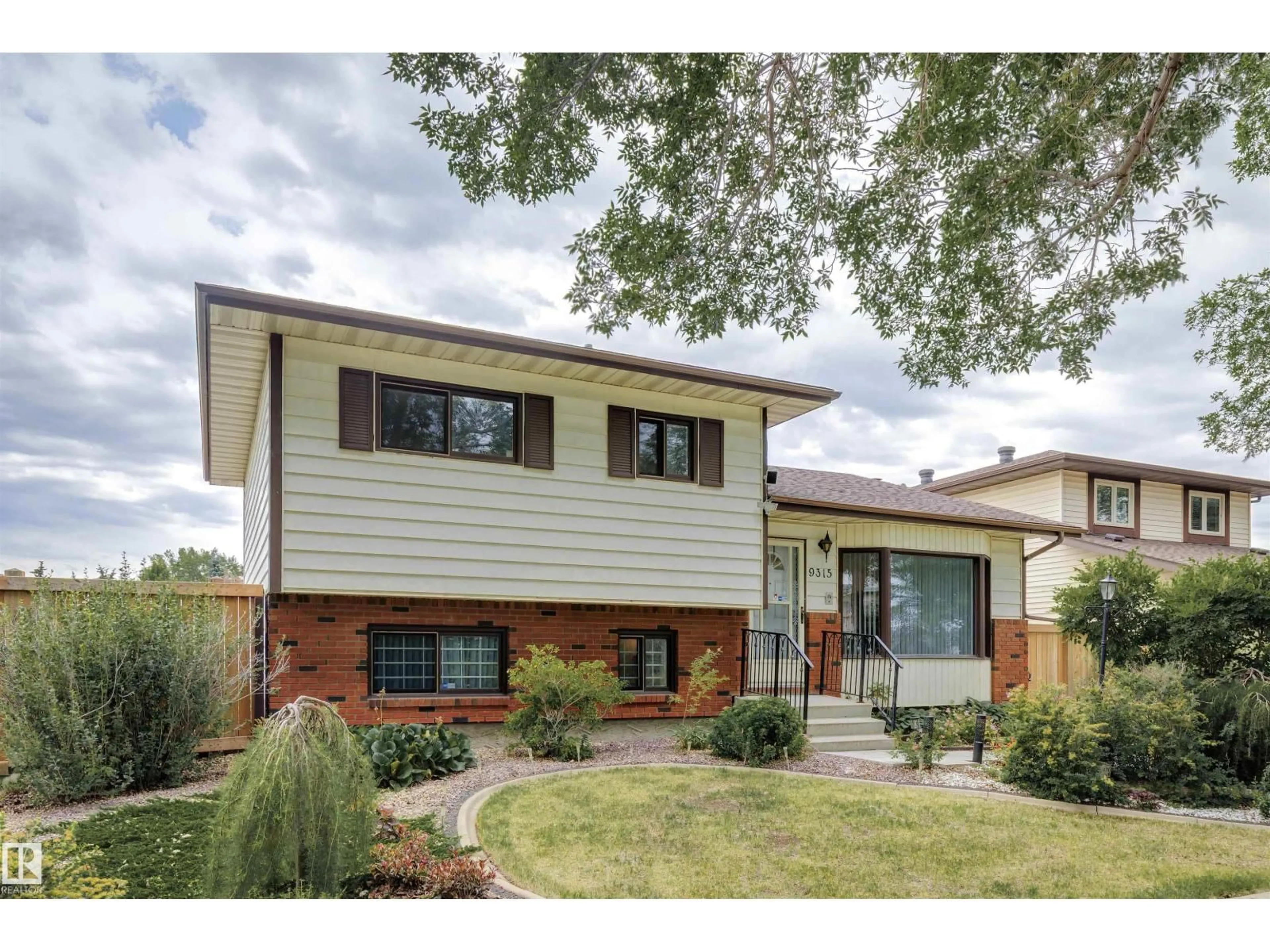 Home with brick exterior material, street for 9315 168 AV, Edmonton Alberta T5Z1Y1