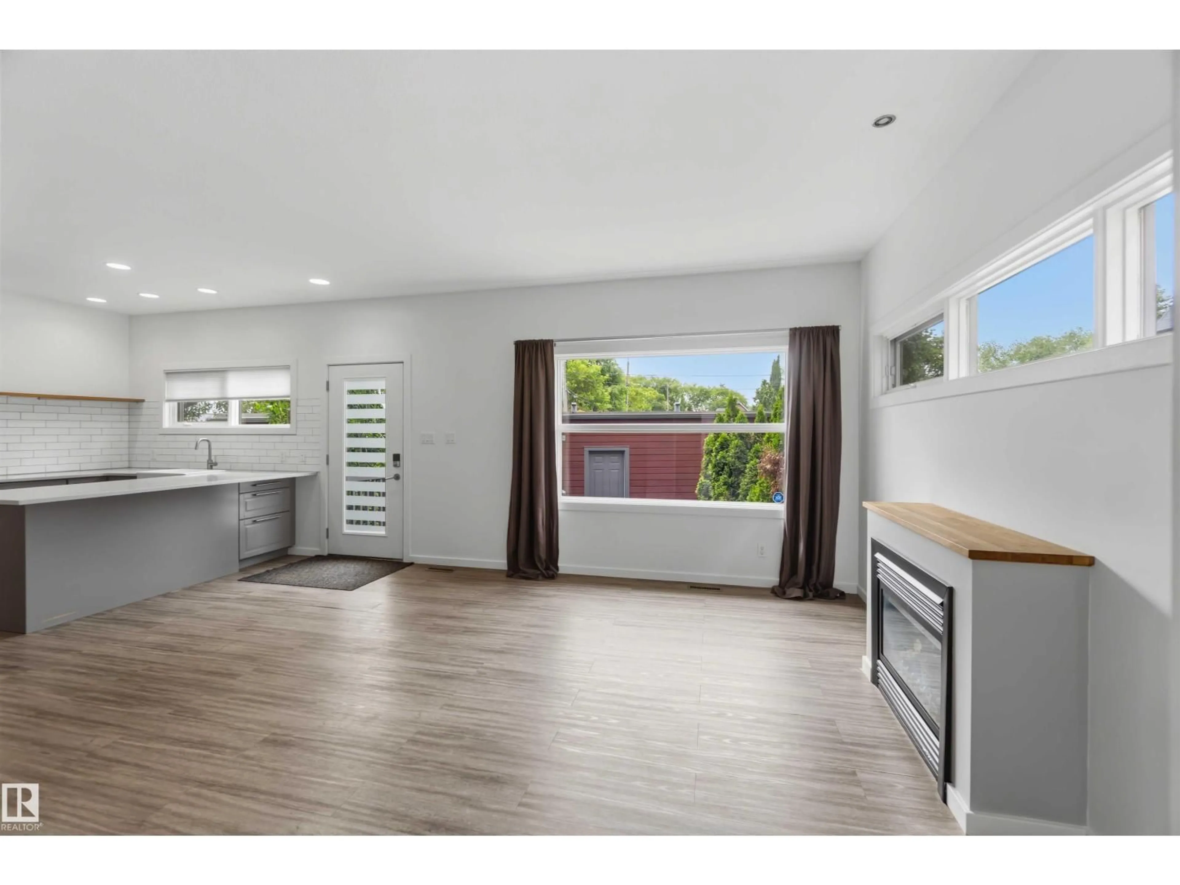 Open concept kitchen, wood/laminate floor for 14315 STONY PLAIN NW, Edmonton Alberta T5N3R6