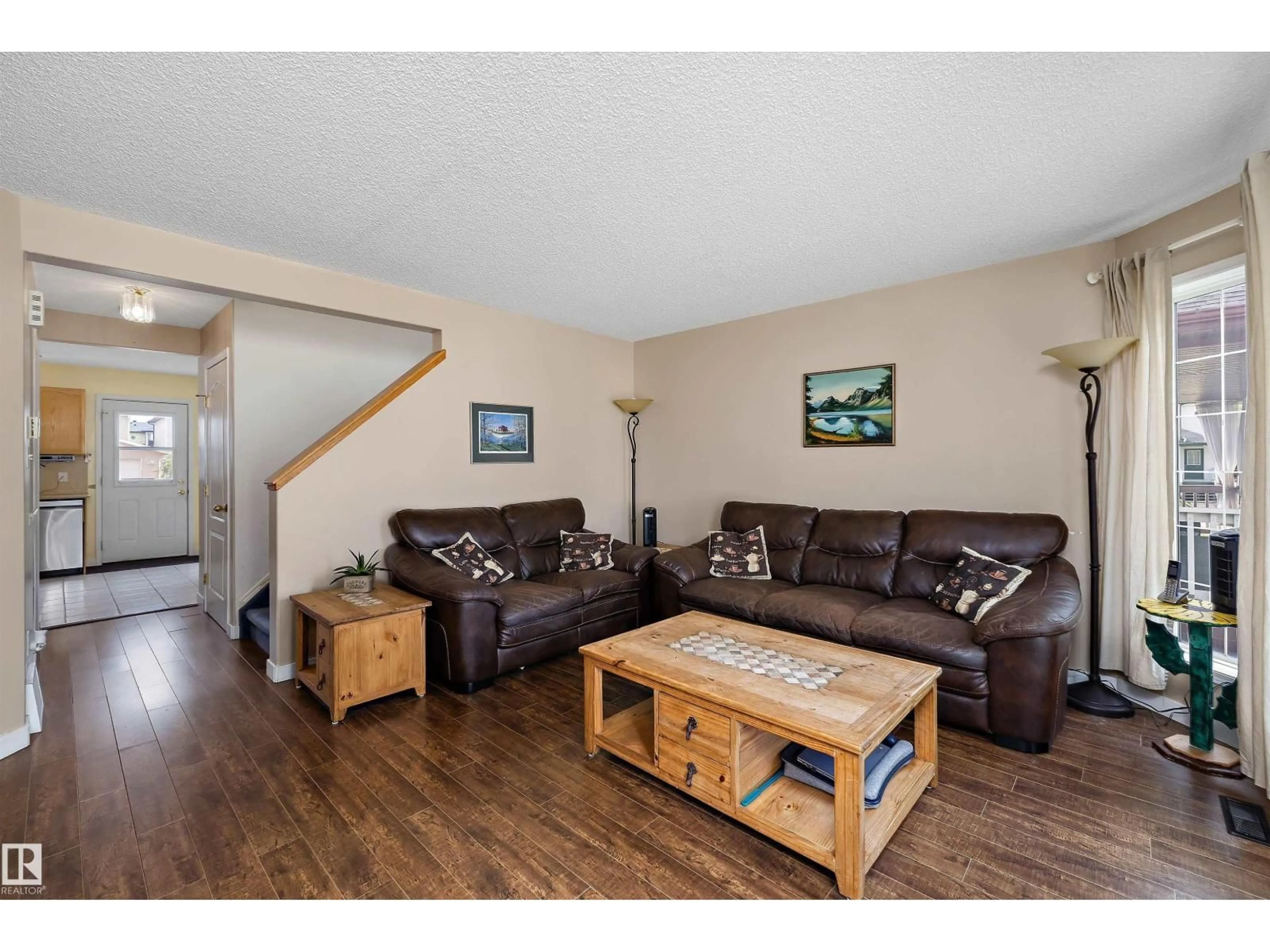 Living room with furniture, wood/laminate floor for 55 CAMPBELL RD, Leduc Alberta T9E8C8