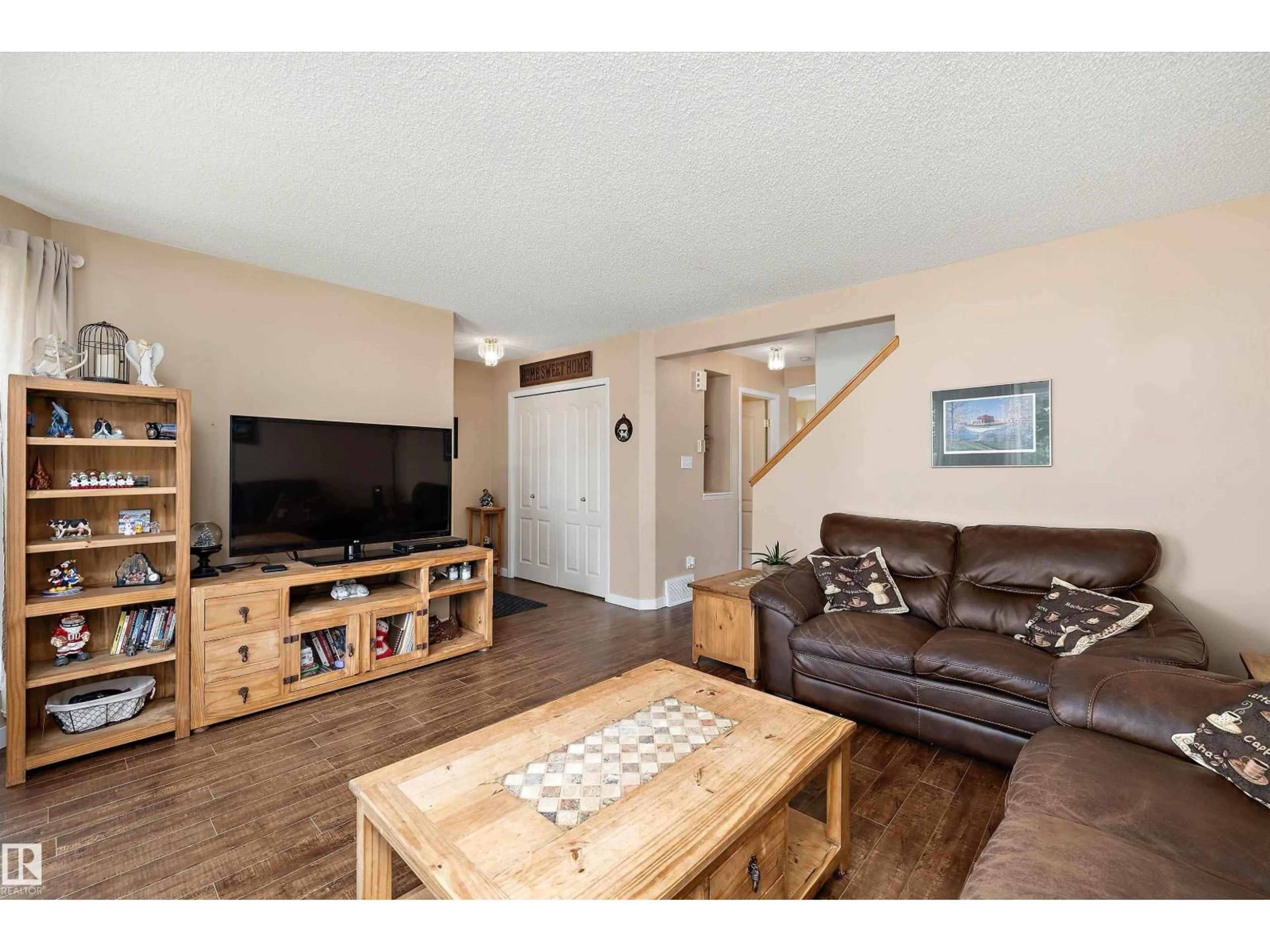 Living room with furniture, wood/laminate floor for 55 CAMPBELL RD, Leduc Alberta T9E8C8