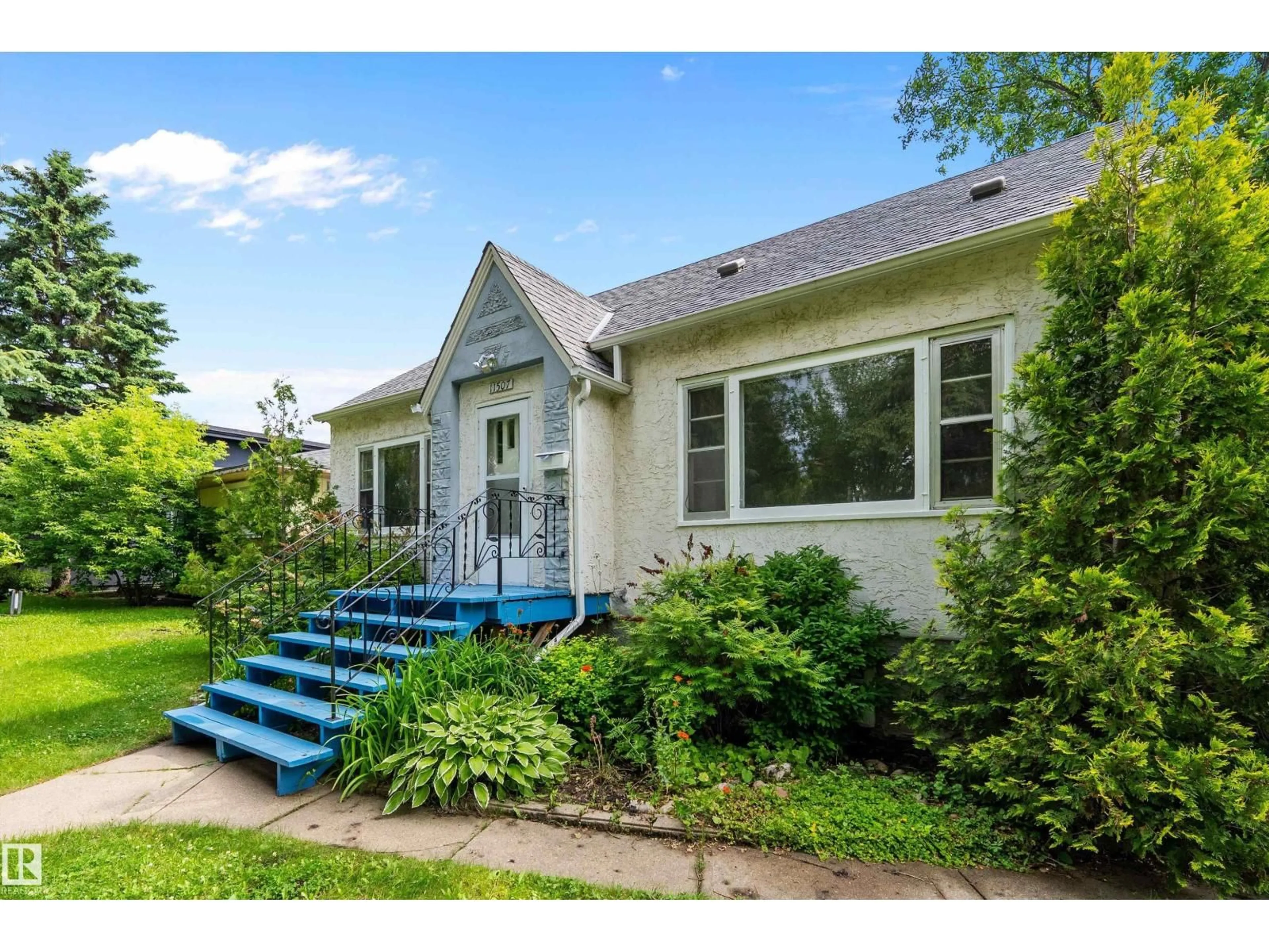 Home with vinyl exterior material, street for 11507 123 ST, Edmonton Alberta T5M0G8