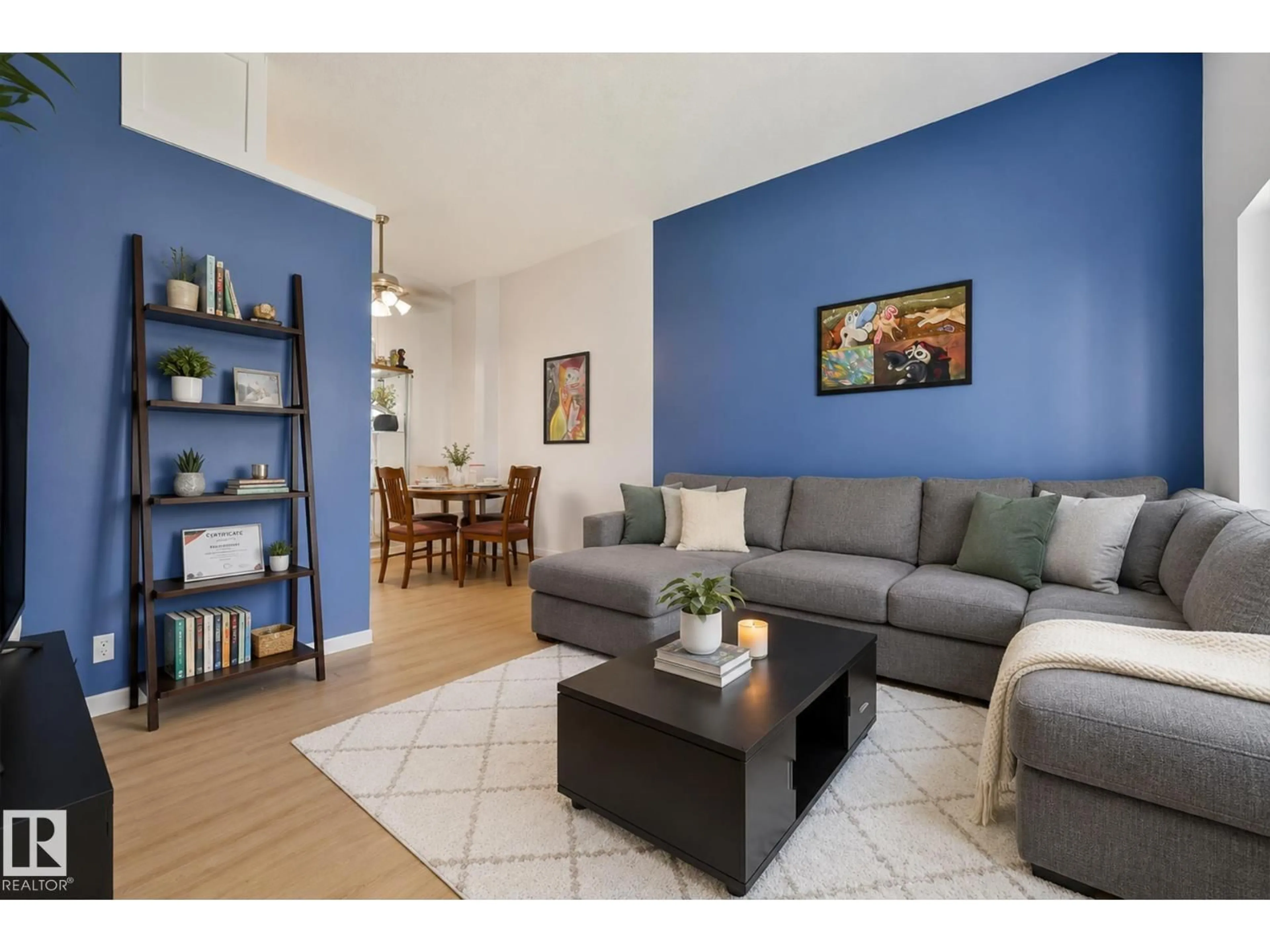 Living room with furniture, wood/laminate floor for 11507 40 AV, Edmonton Alberta T6J0R3