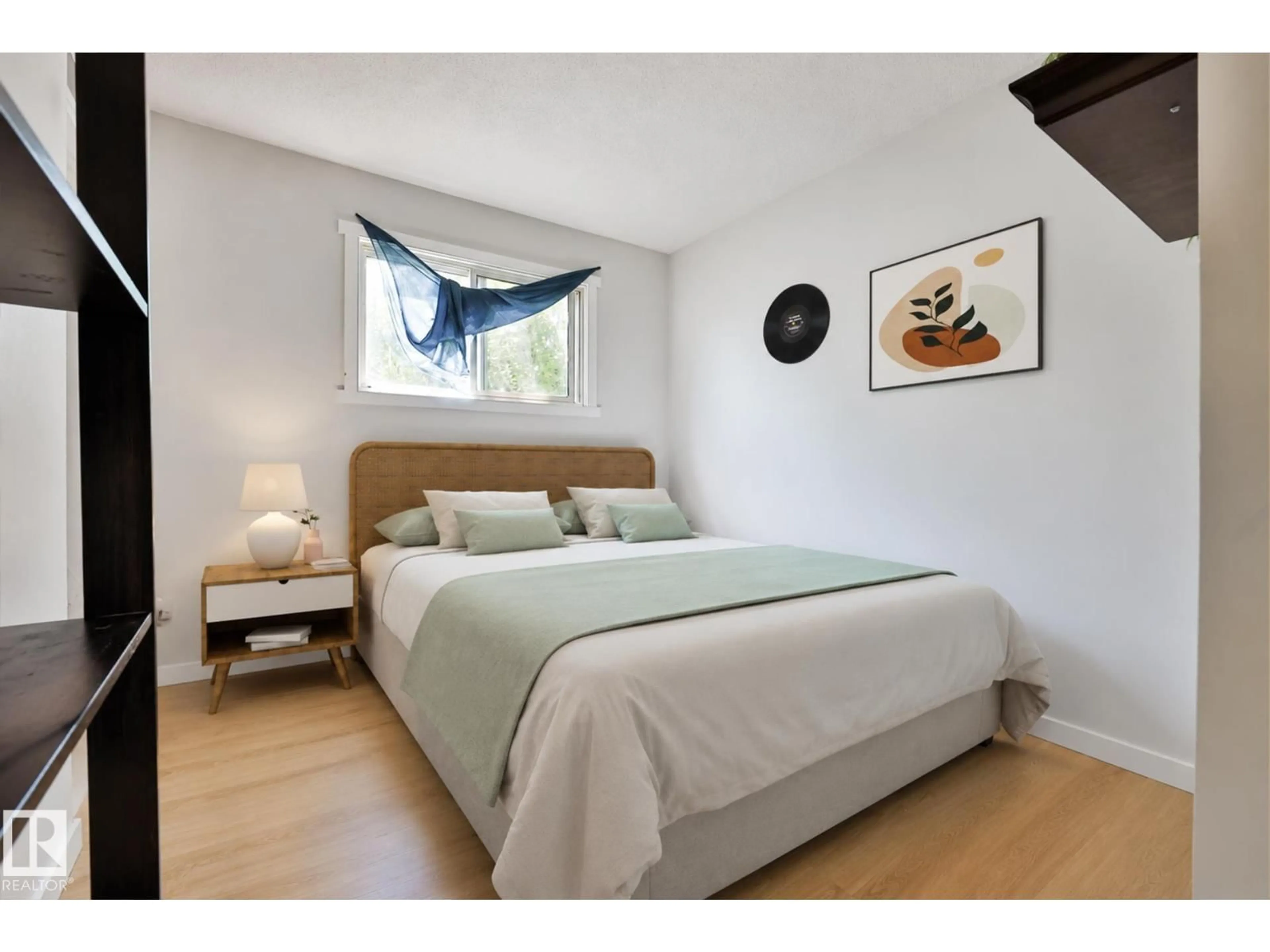 Bedroom with bed, wood/laminate floor for 11507 40 AV, Edmonton Alberta T6J0R3