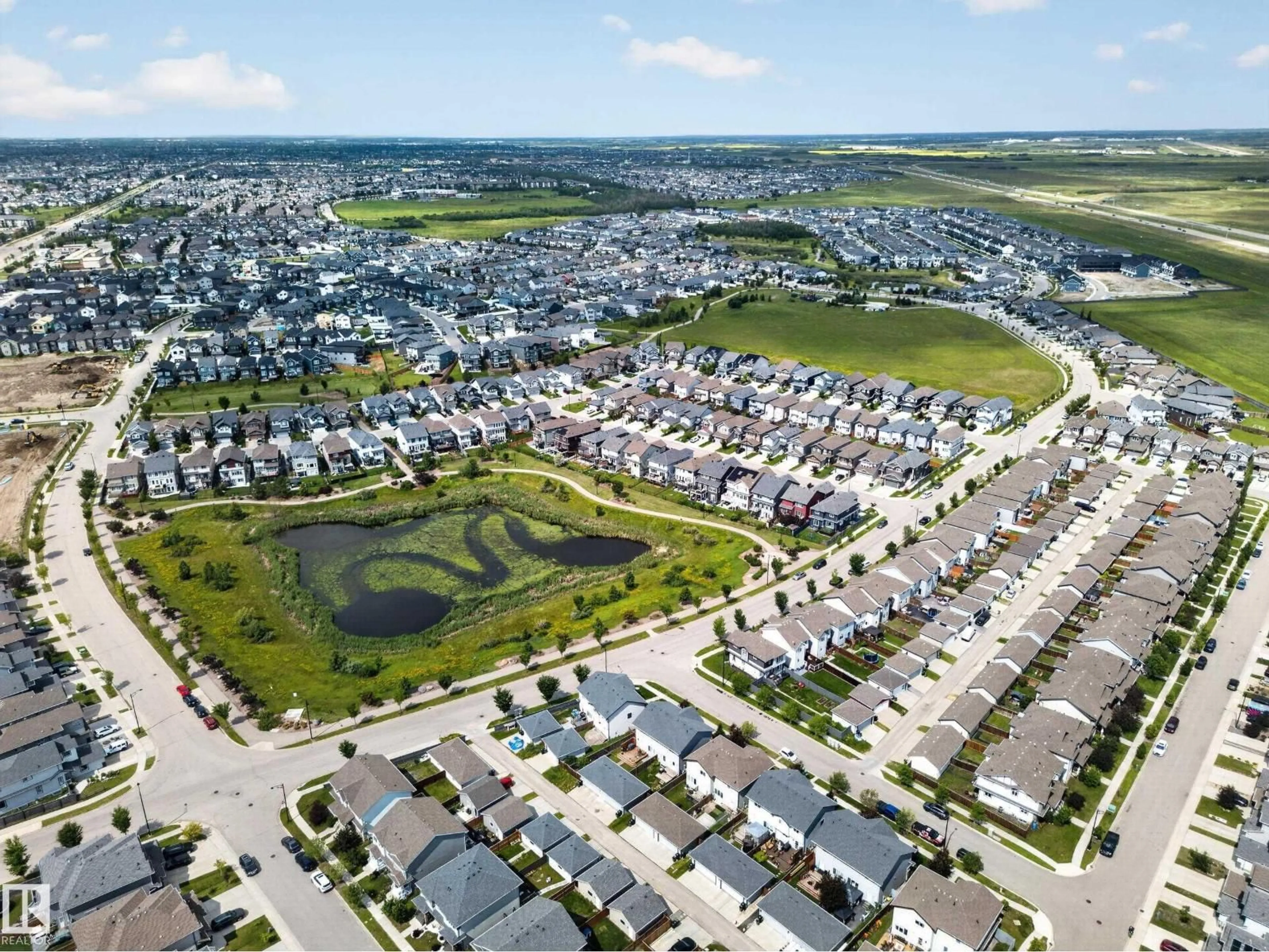 A pic from outside/outdoor area/front of a property/back of a property/a pic from drone, street for 227 CY BECKER BLVD, Edmonton Alberta T5Y3R8