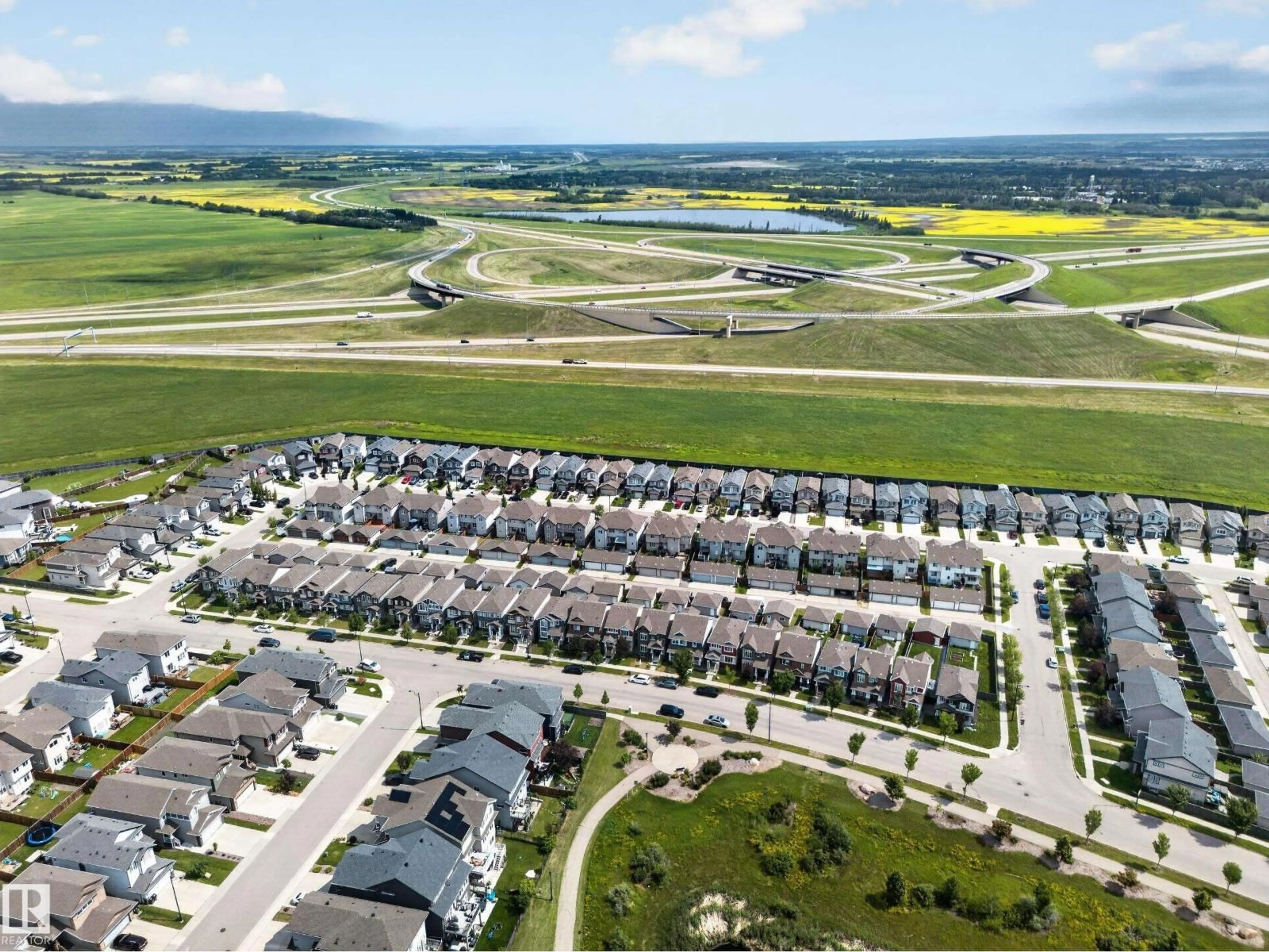 A pic from outside/outdoor area/front of a property/back of a property/a pic from drone, mountain view for 227 CY BECKER BLVD, Edmonton Alberta T5Y3R8