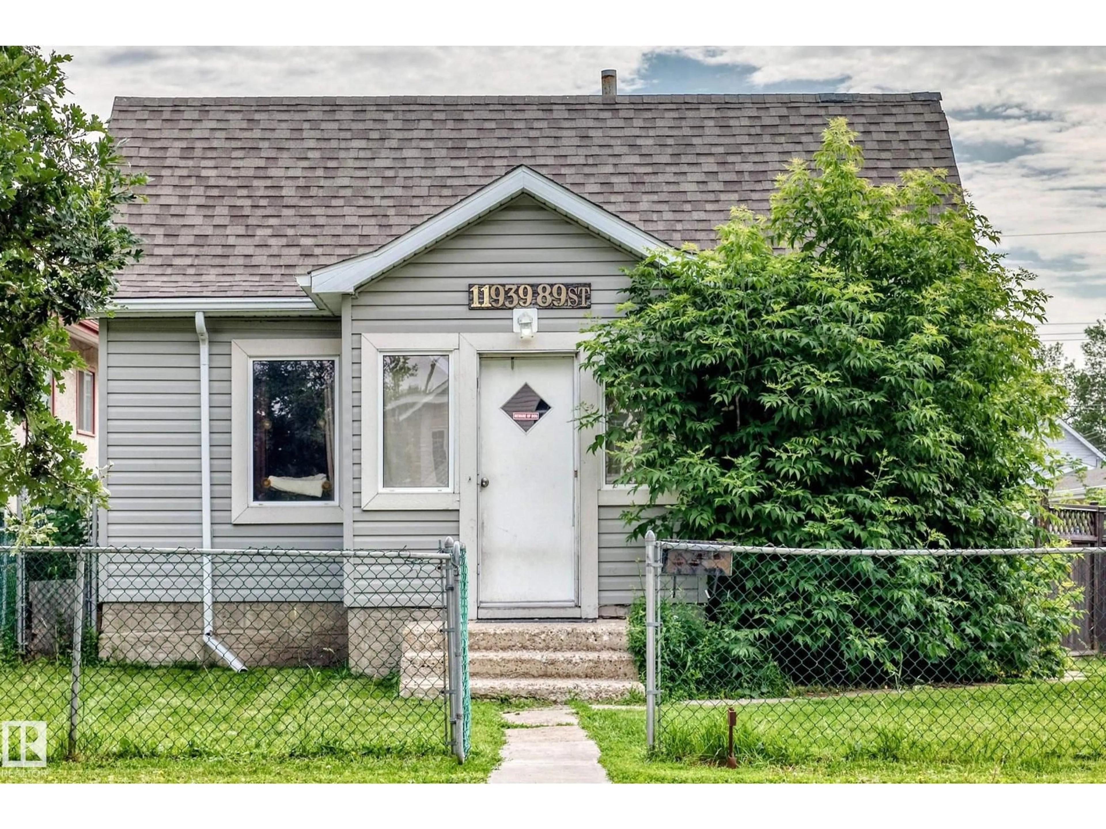 Home with vinyl exterior material, street for NW - 11939 89 ST, Edmonton Alberta T5B3V9