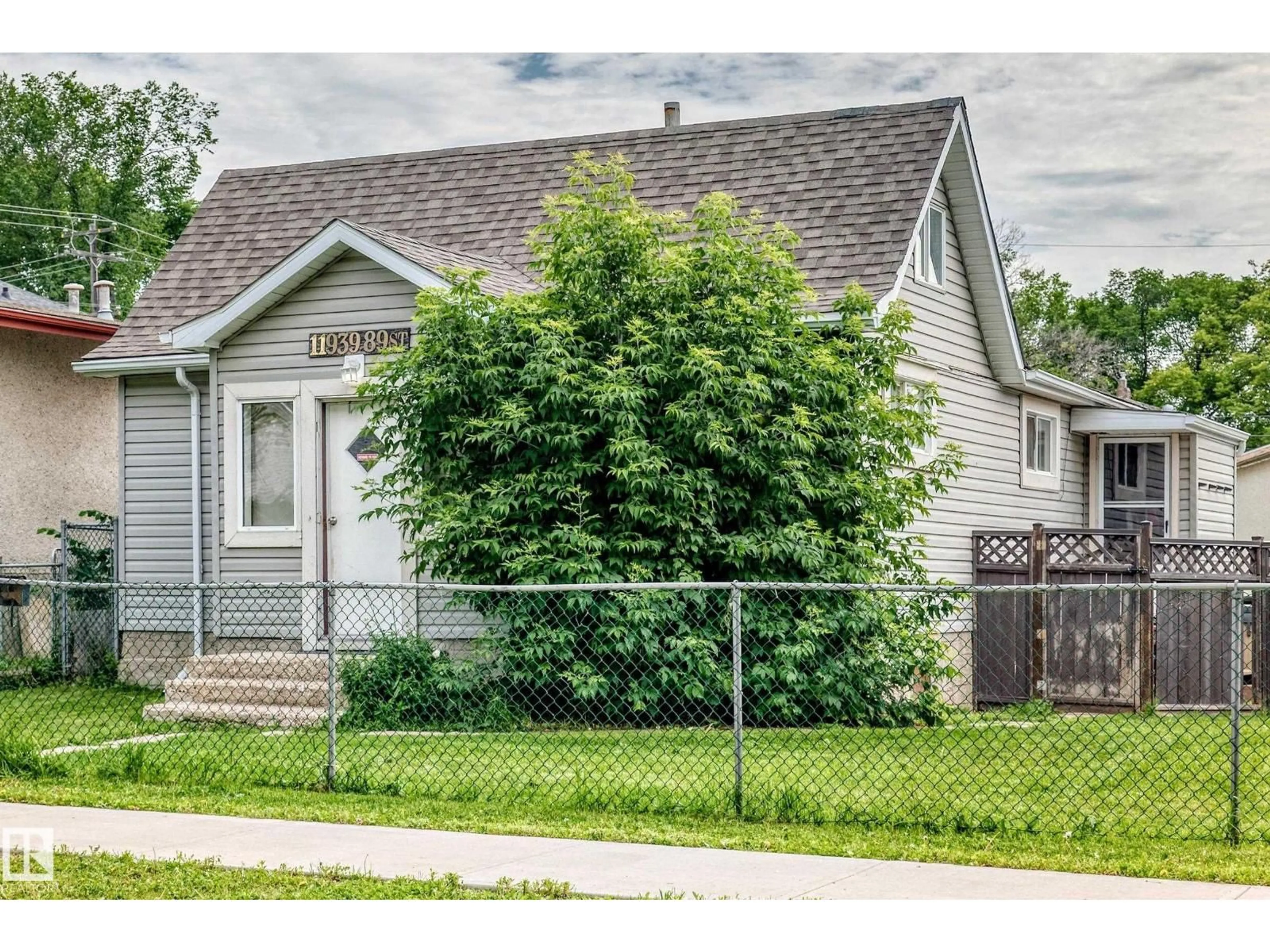Home with vinyl exterior material, street for NW - 11939 89 ST, Edmonton Alberta T5B3V9