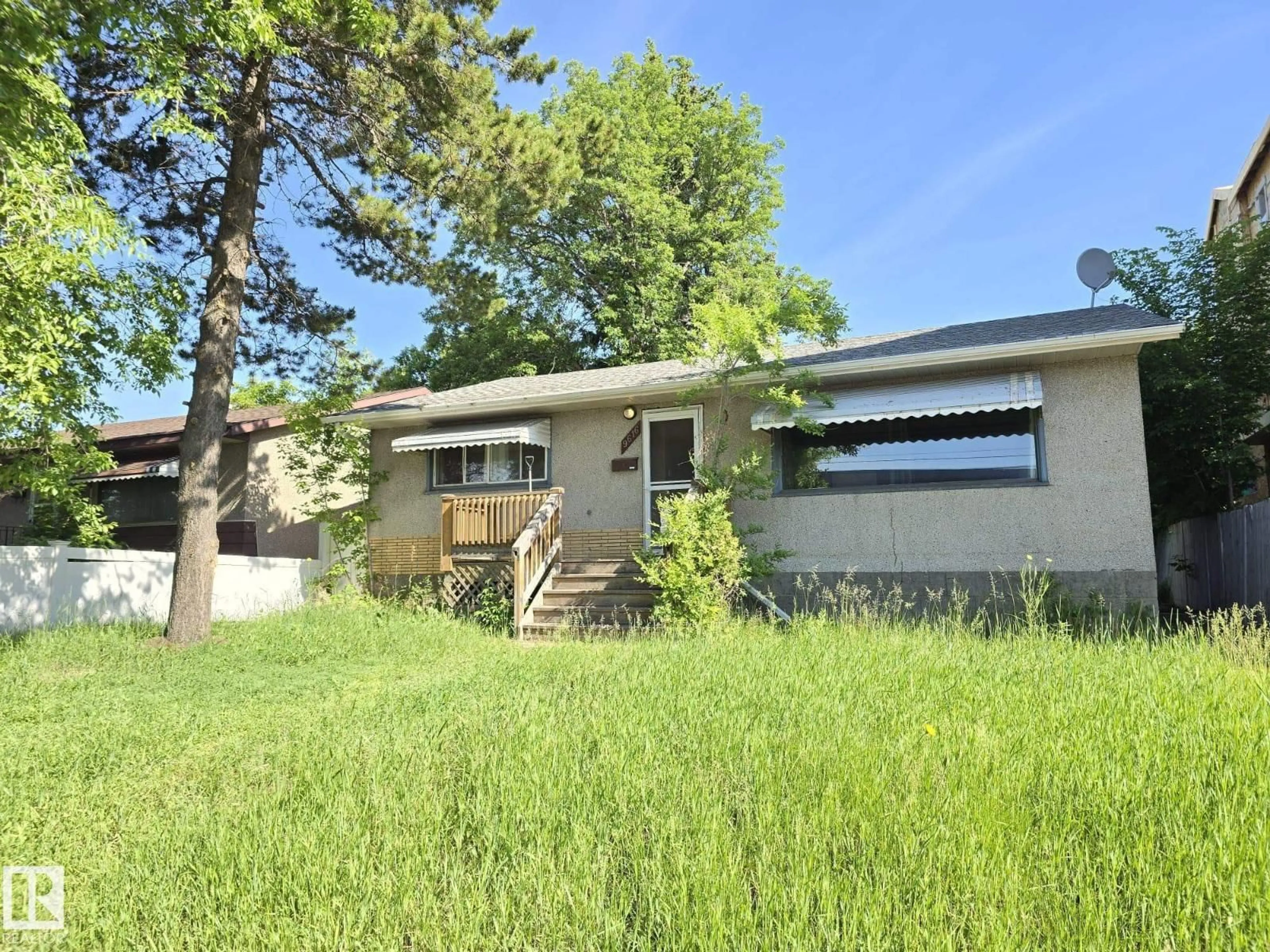 Home with vinyl exterior material, street for 9616 63 AV, Edmonton Alberta T6E0G5