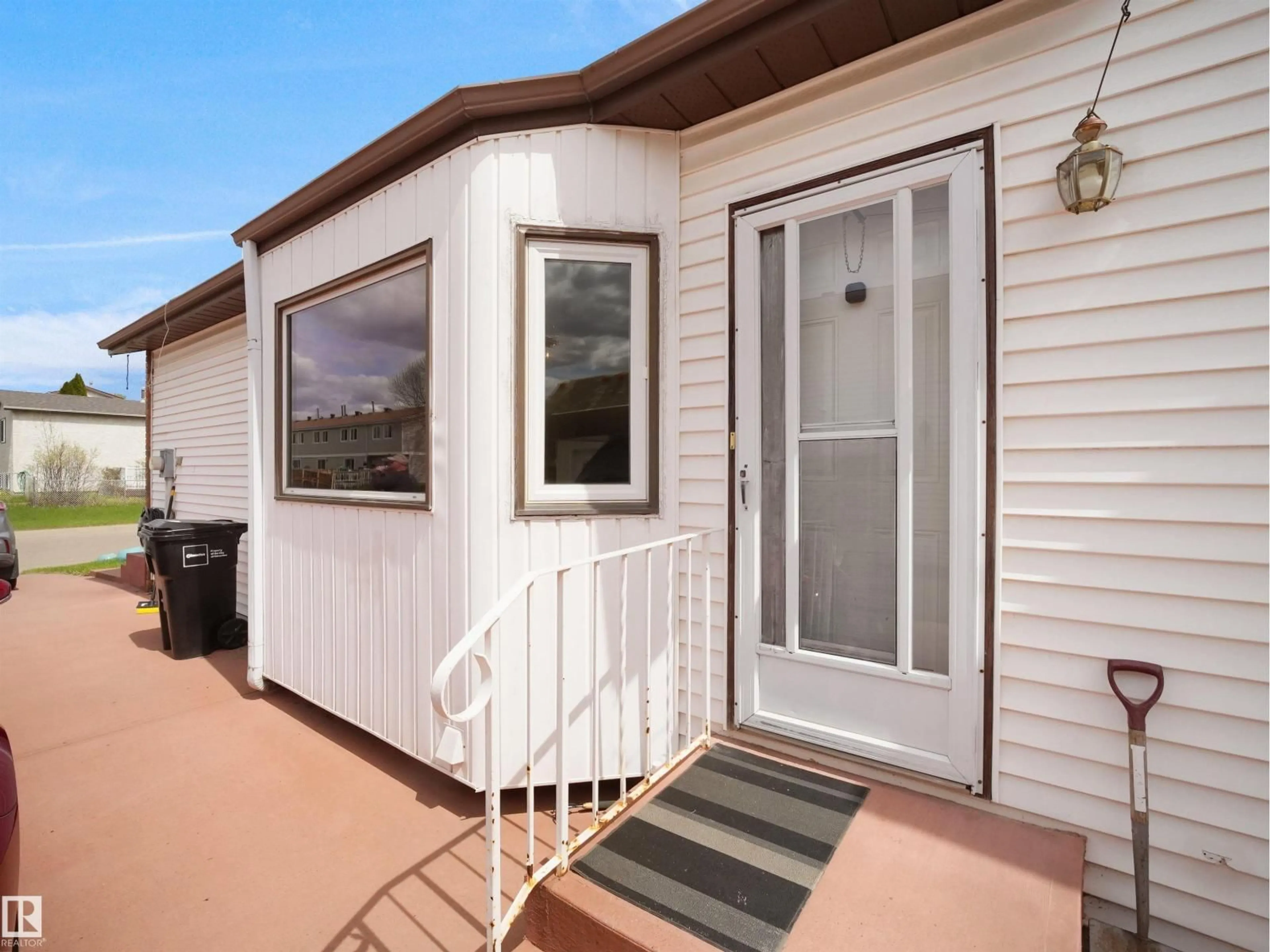 Home with vinyl exterior material, street for 10711 24 AV, Edmonton Alberta T6J5P9