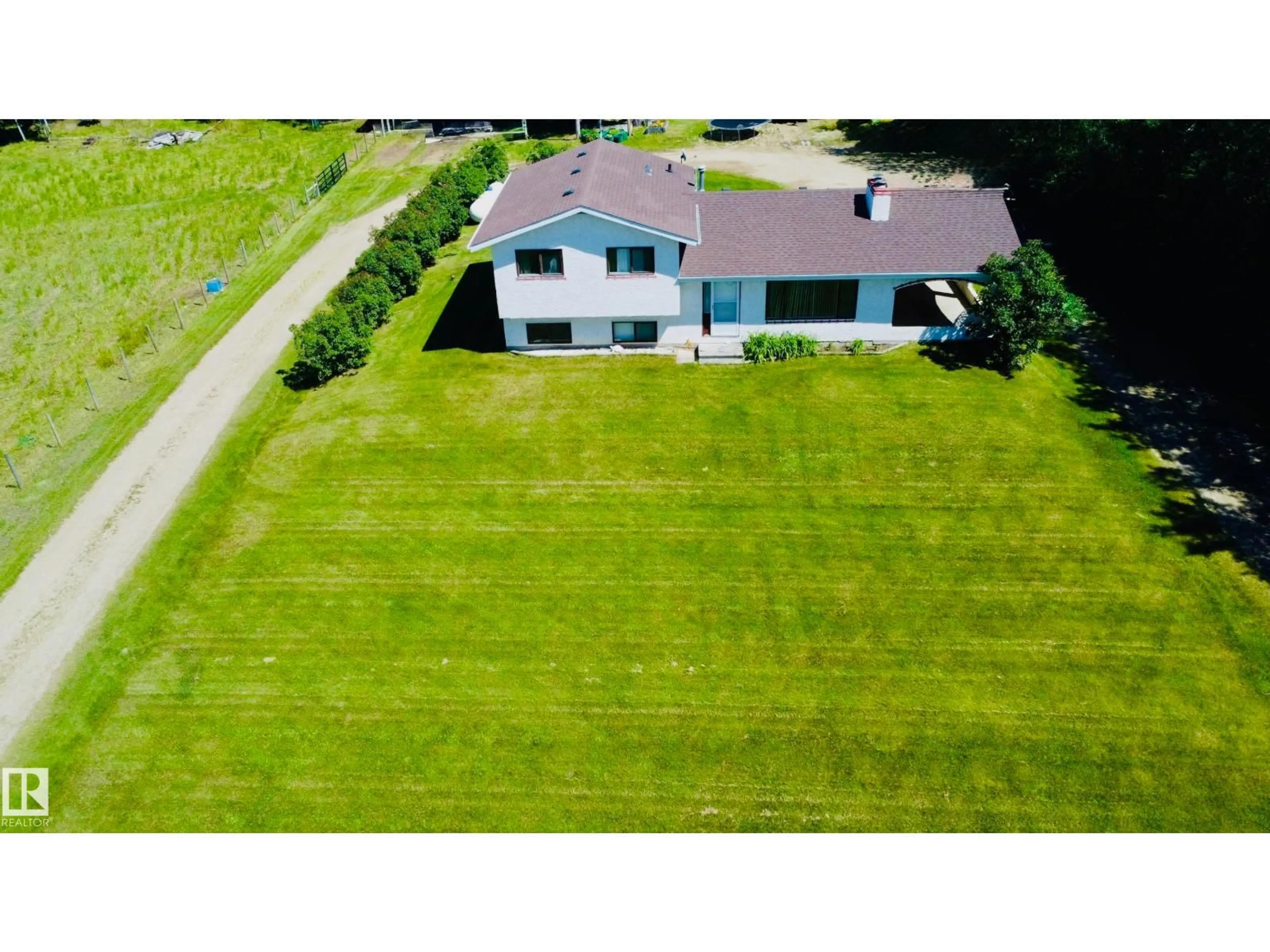A pic from outside/outdoor area/front of a property/back of a property/a pic from drone, unknown for 54207 RGE ROAD 52, Rural Lac Ste. Anne County Alberta T0E0L0