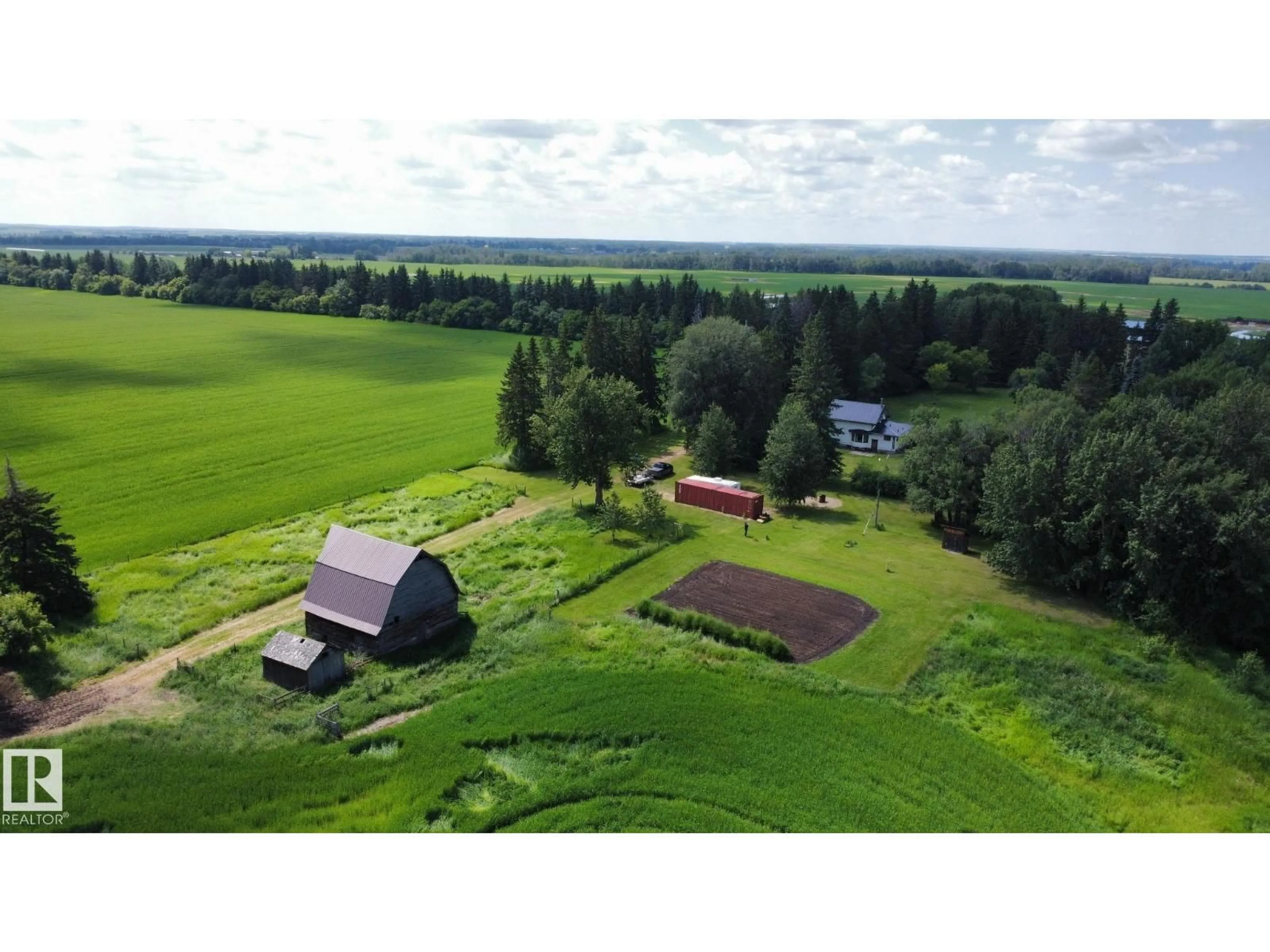 A pic from outside/outdoor area/front of a property/back of a property/a pic from drone, unknown for 60417 RR 10, Rural Westlock County Alberta T7P2N9