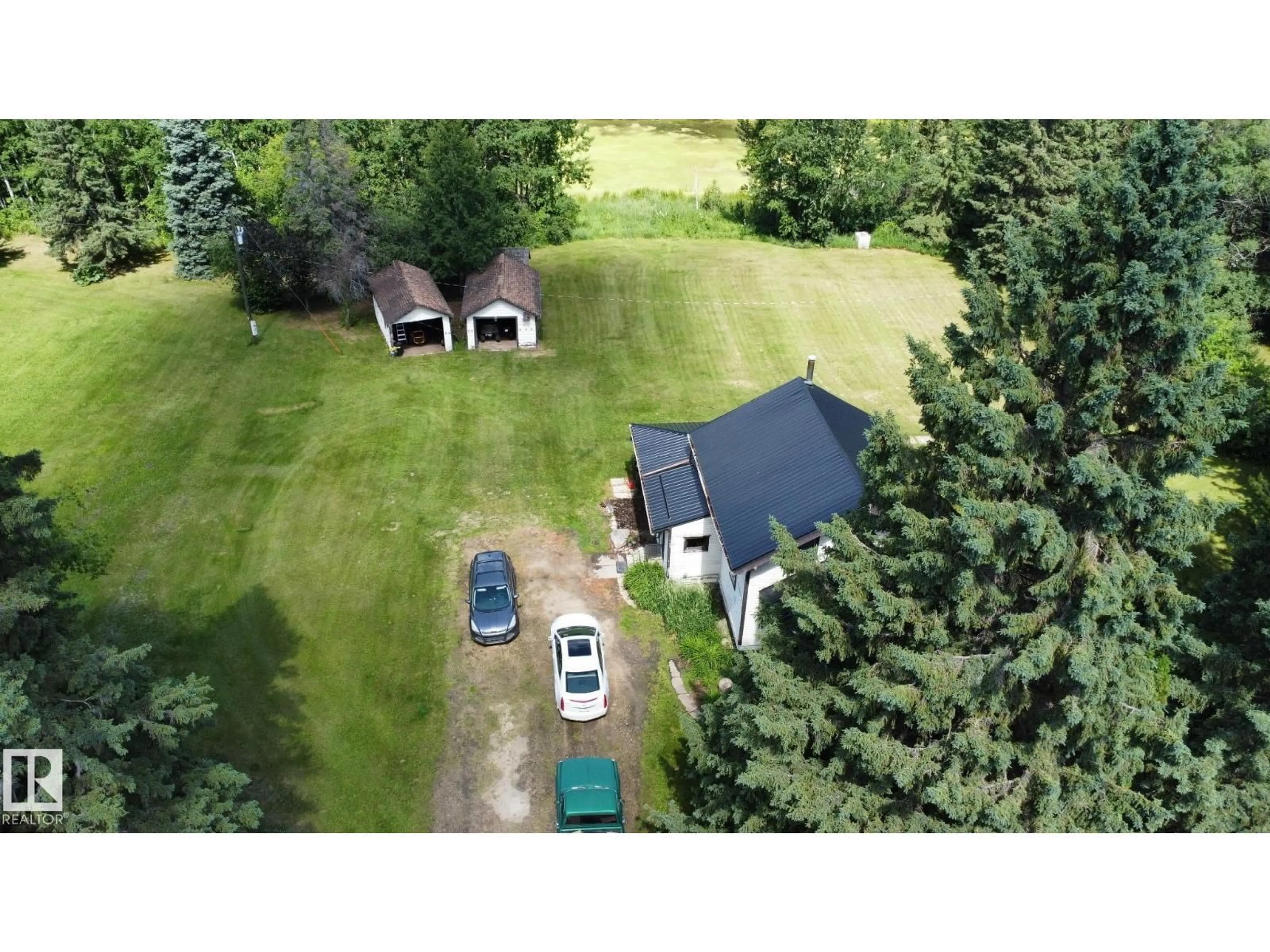 A pic from outside/outdoor area/front of a property/back of a property/a pic from drone, unknown for 60417 RR 10, Rural Westlock County Alberta T7P2N9