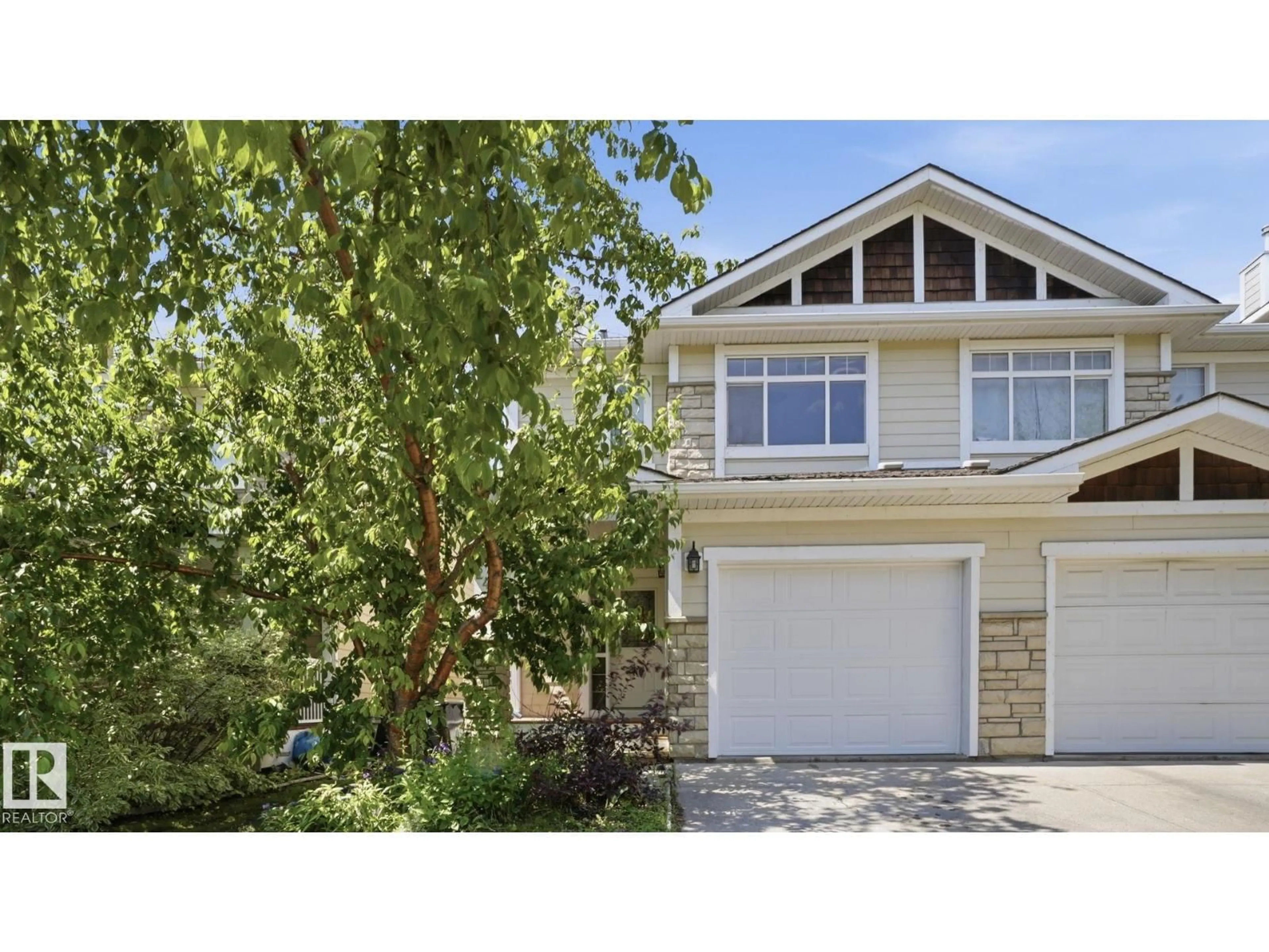 Home with vinyl exterior material, street for 24 - 6410 134 AV, Edmonton Alberta T5A0A8