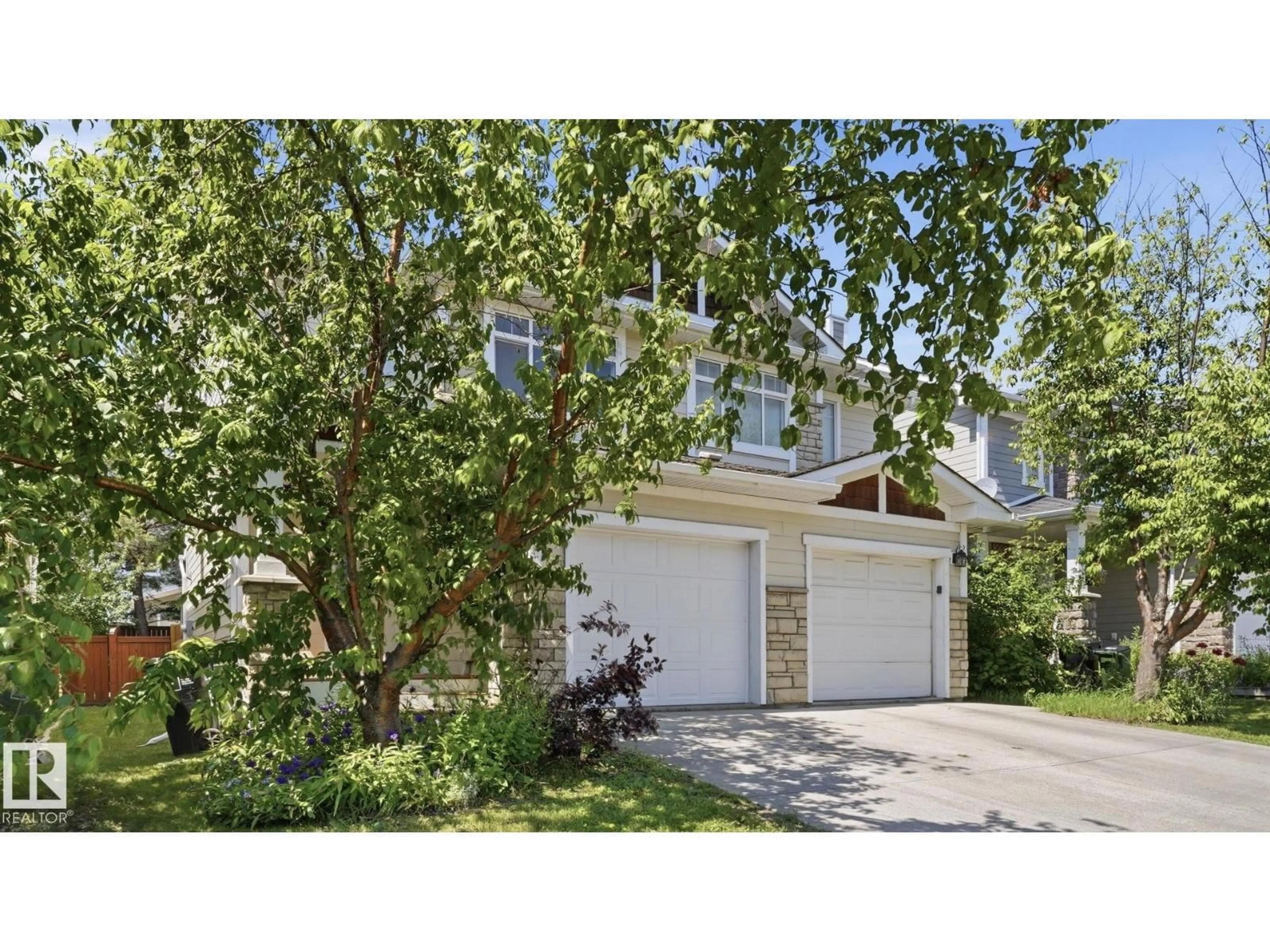 Home with vinyl exterior material, street for 24 - 6410 134 AV, Edmonton Alberta T5A0A8