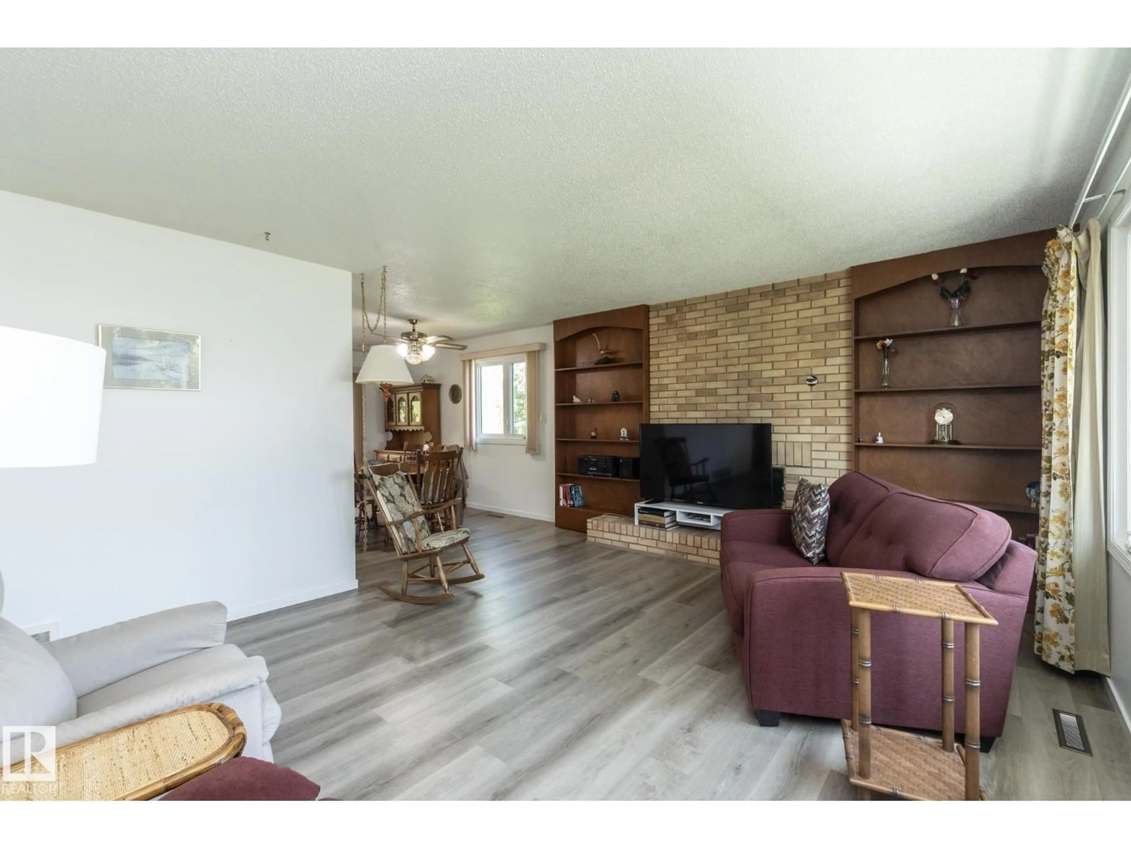 Living room with furniture, wood/laminate floor for 4302 53 ST, Leduc Alberta T9E5B1