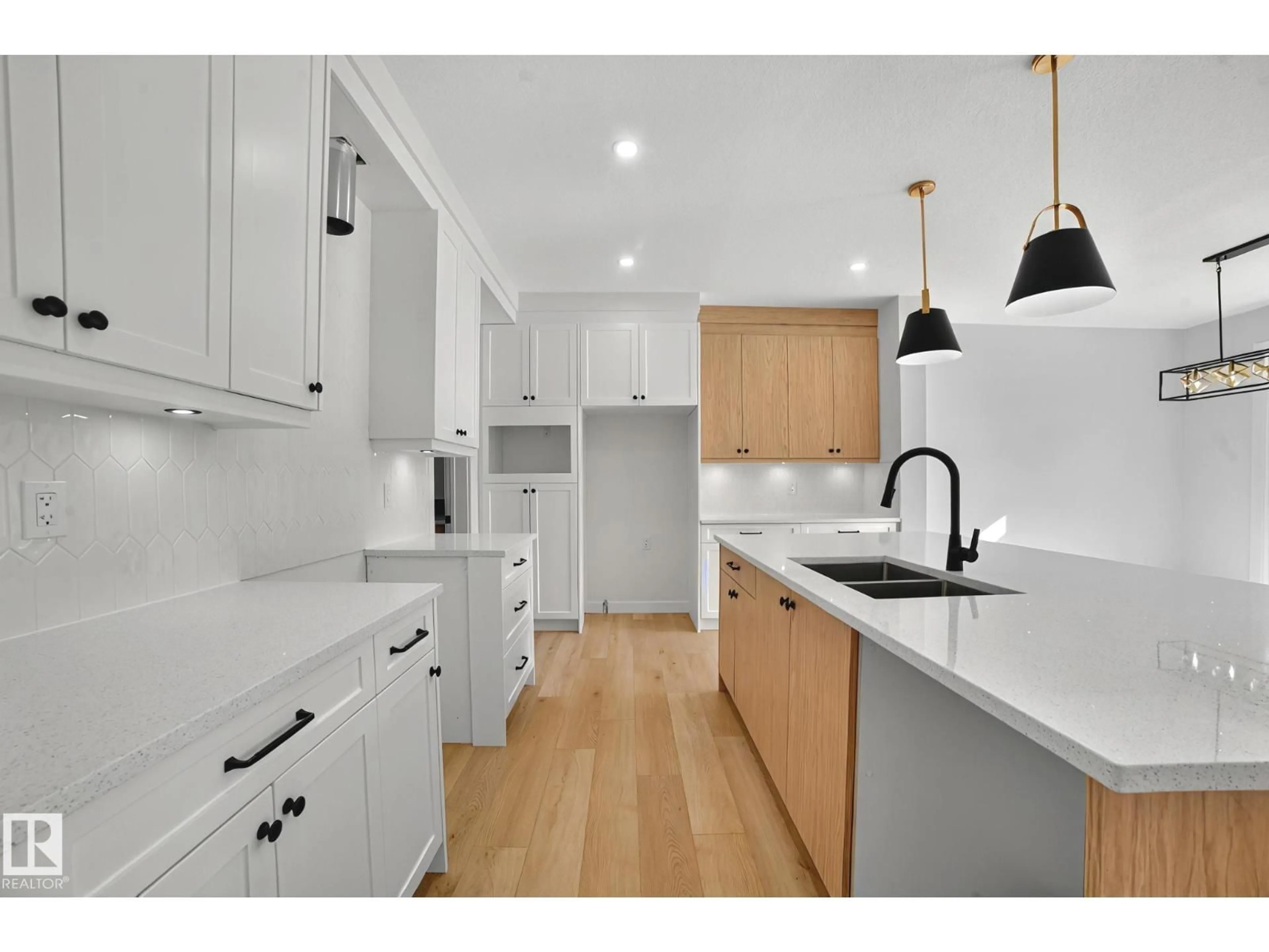 Open concept kitchen, wood/laminate floor for 204 FALCON CRESCENT, Leduc Alberta T0B3M3
