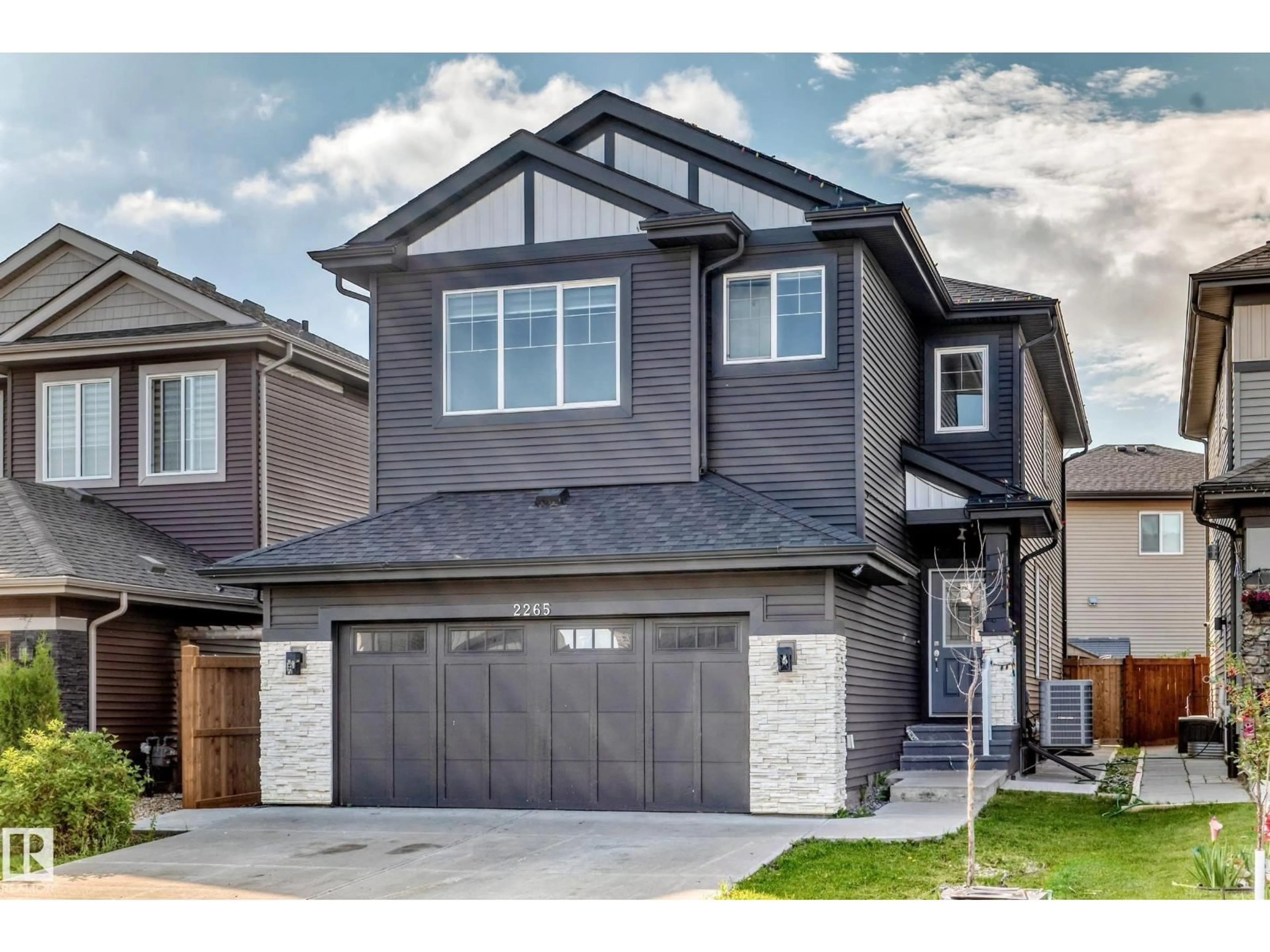 Home with vinyl exterior material, street for SW SW - 2265 57 ST, Edmonton Alberta T6X2P3